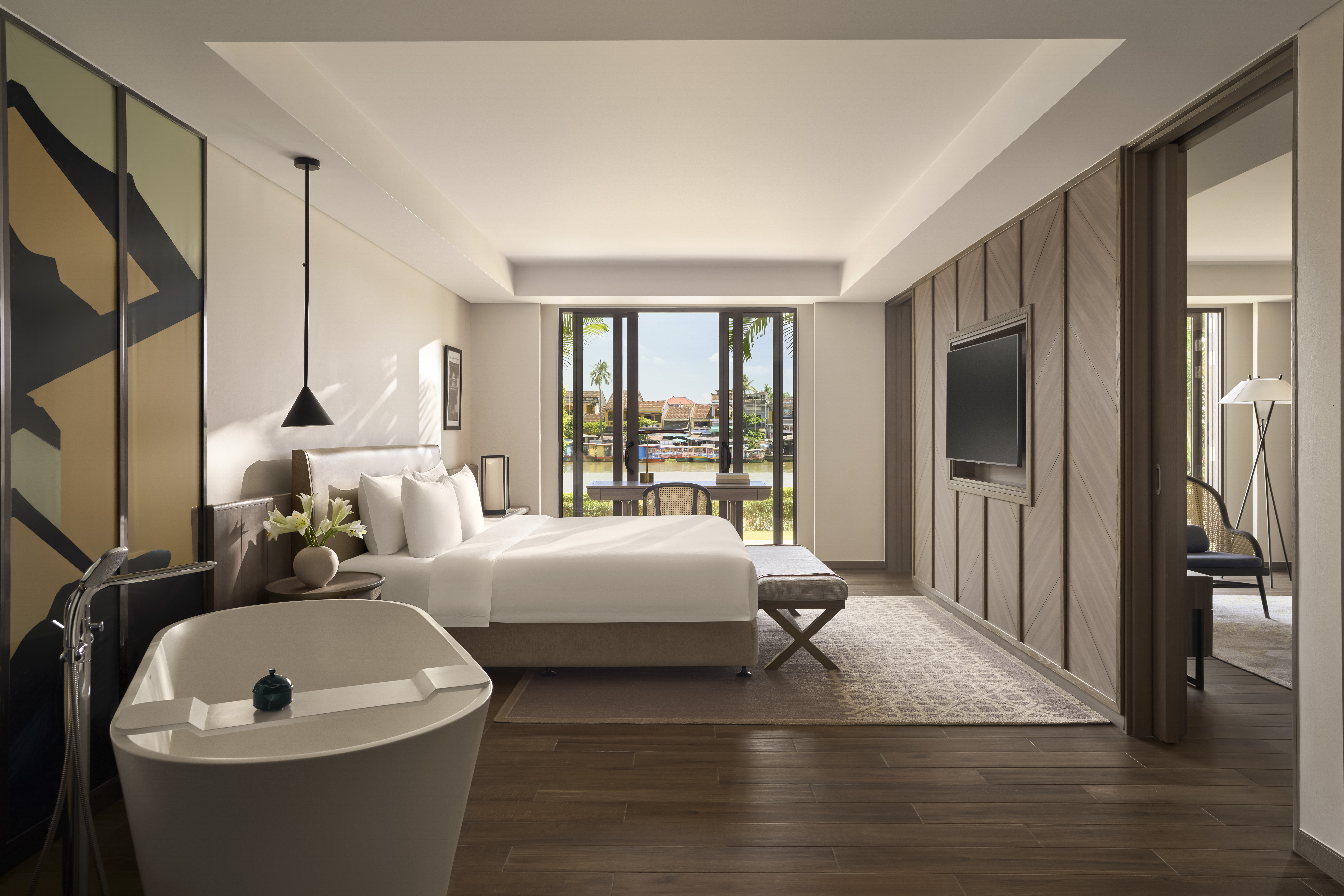 VIGNETTE COLLECTION MOIRE HOI AN BY-guestroom-River-view suite with soft tones and elegantly layered details. .jpg