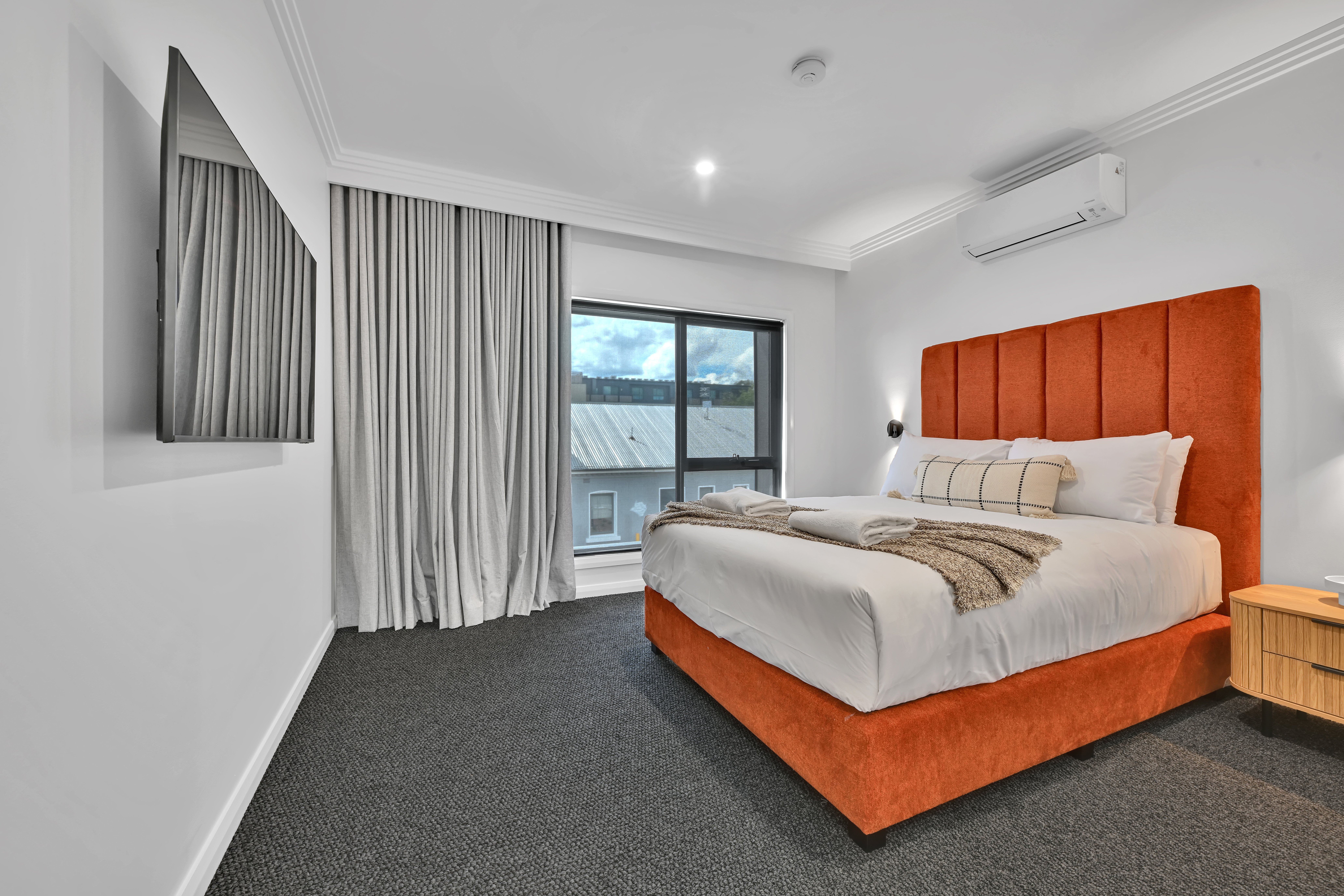 The Mac-guestroom-Upstairs king bedroom with smart TV.jpg
