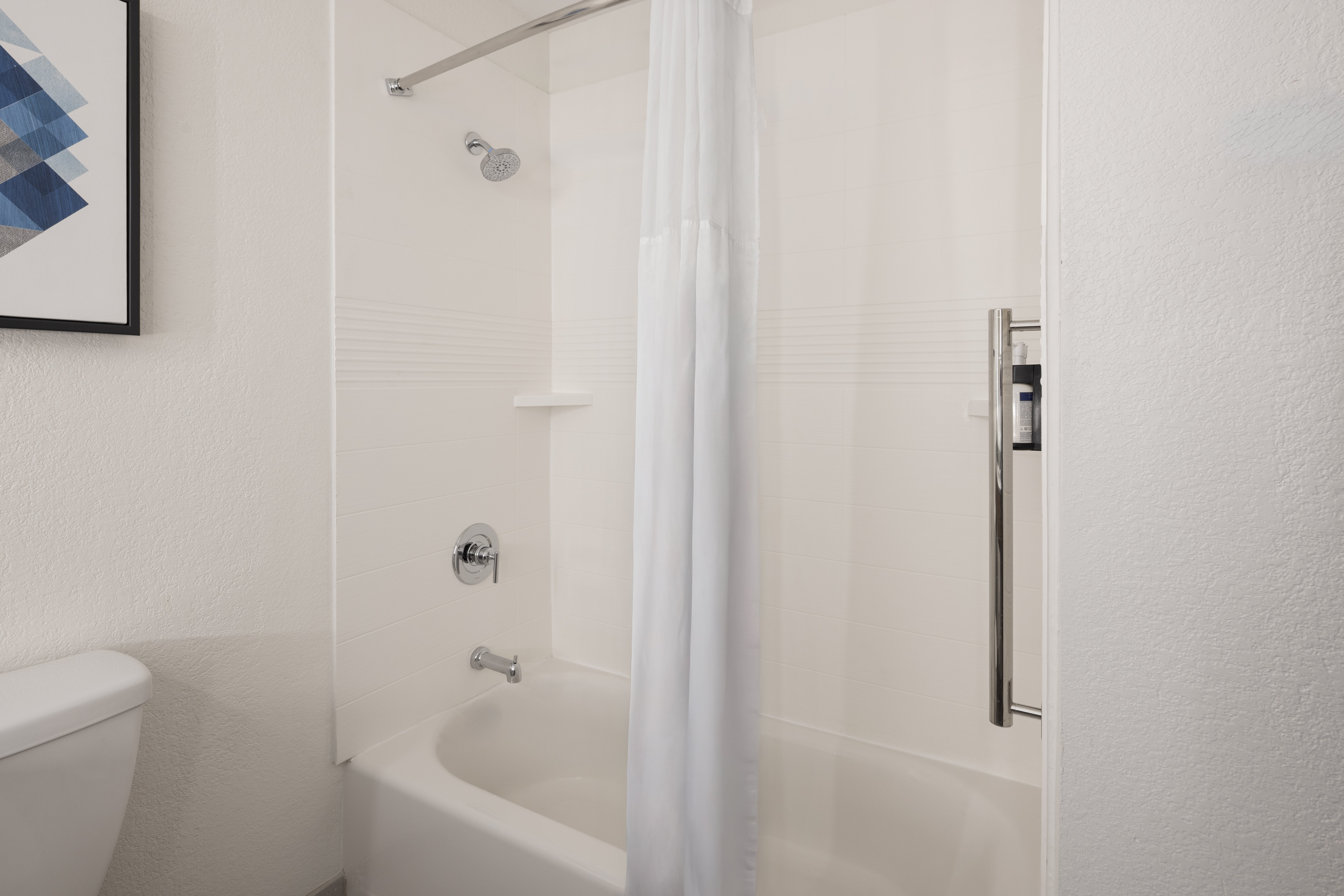 GARNER HOTEL SURPRISE BY IHG-guestroom-Our well-lit guest bathroom has a spacious tub..jpg