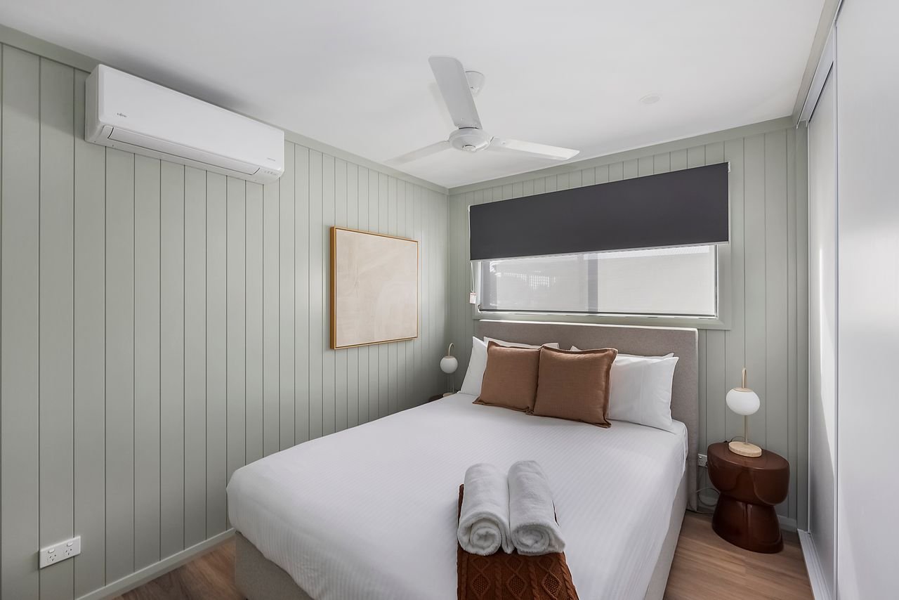 REFLECTIONS FORSTER BEACH - HO-guestroom-One FO Bed.jpg