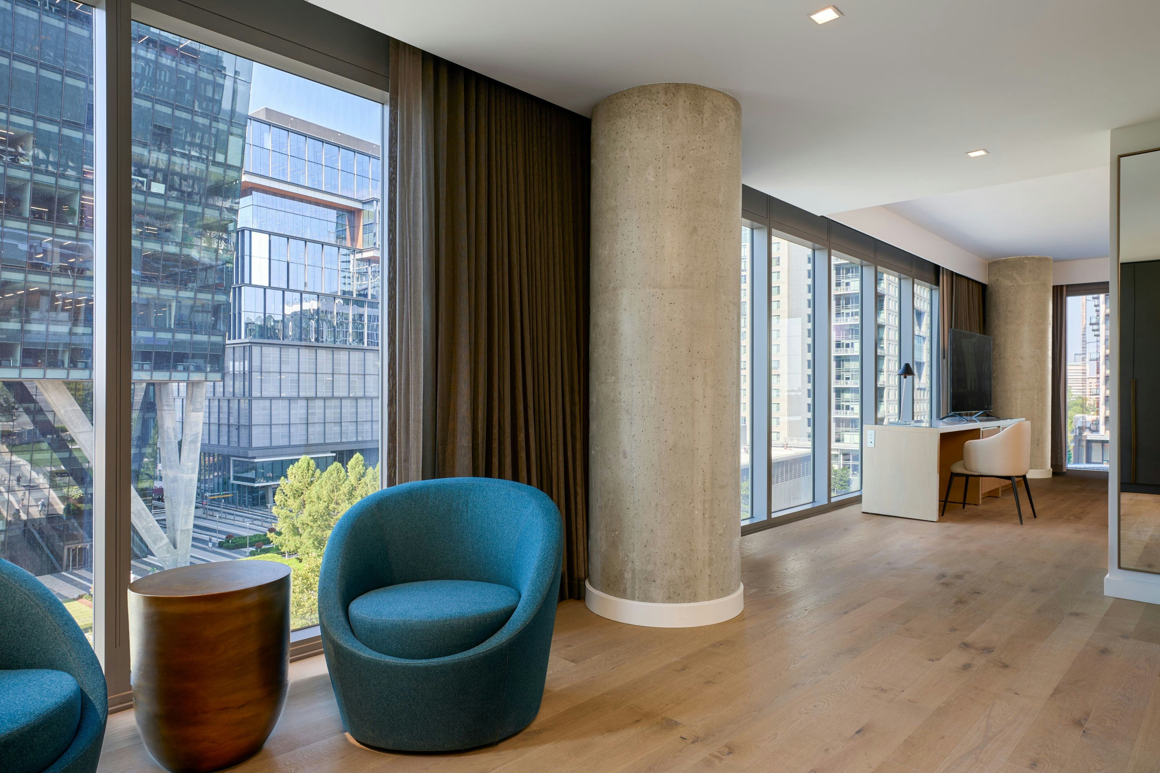 JW Marriott Reston Station-guestroom-Junior Suite, 2 Queen Living Room.jpg