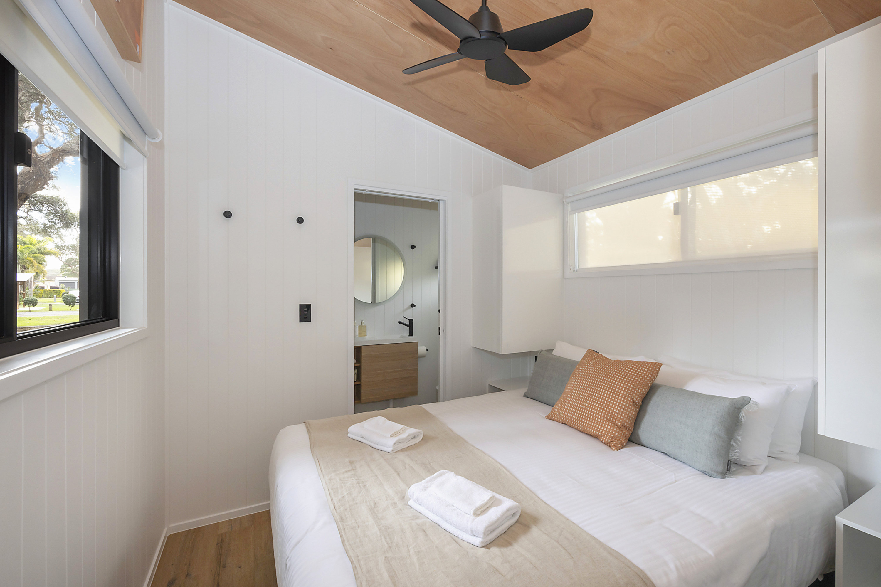 REFLECTIONS NORTH HAVEN - HOLI-guestroom-NOH TH Bed.jpg