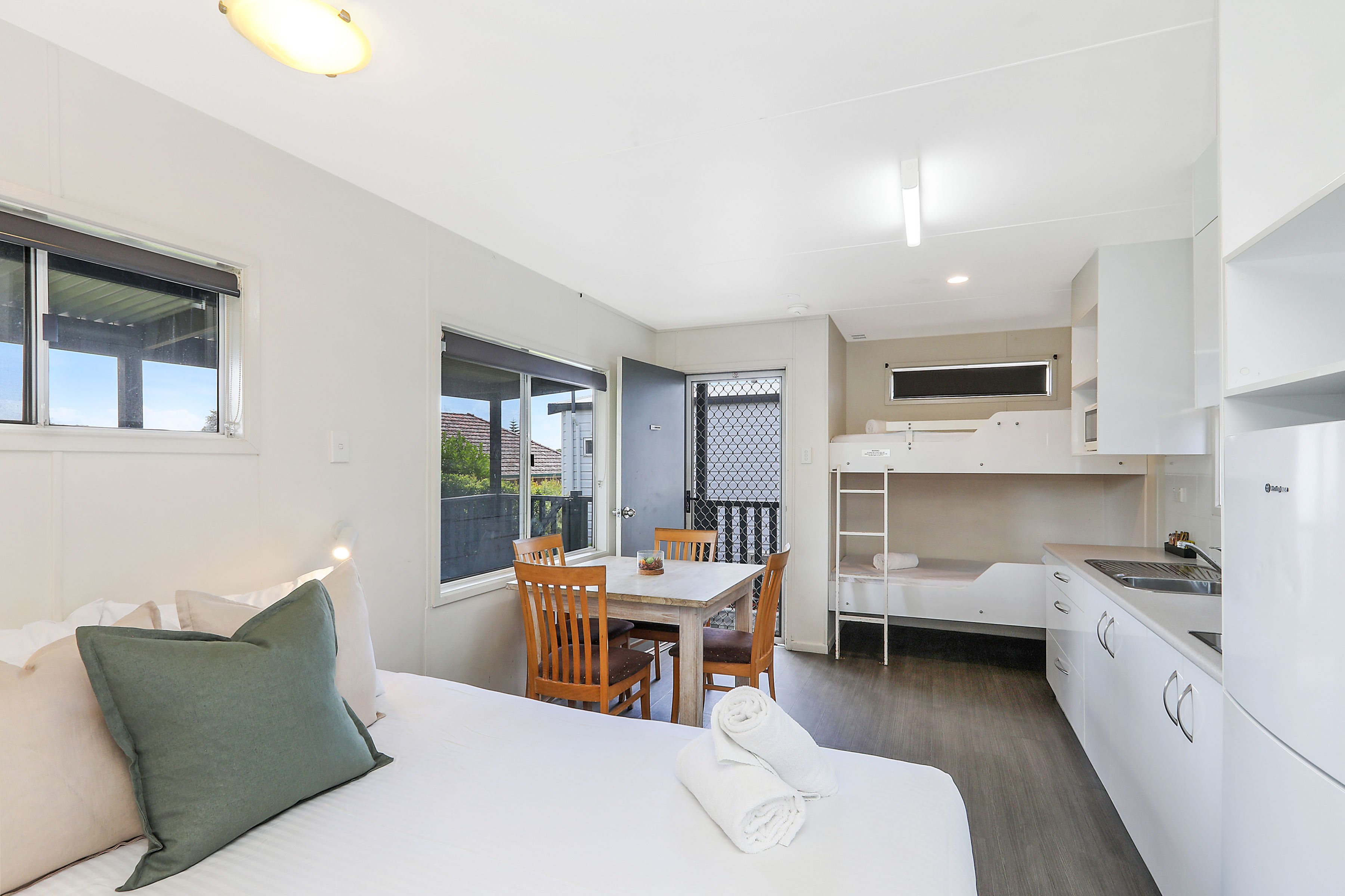 REFLECTIONS SHAWS BAY - HOLIDA-guestroom-SB Strd Fourpax Bed.jpg