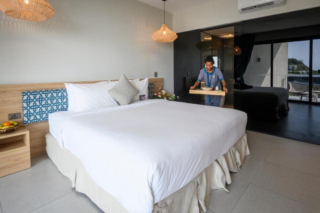 Loloata Island Resort-guestroom-Loloata Overwater Suite Bedroom.jpg