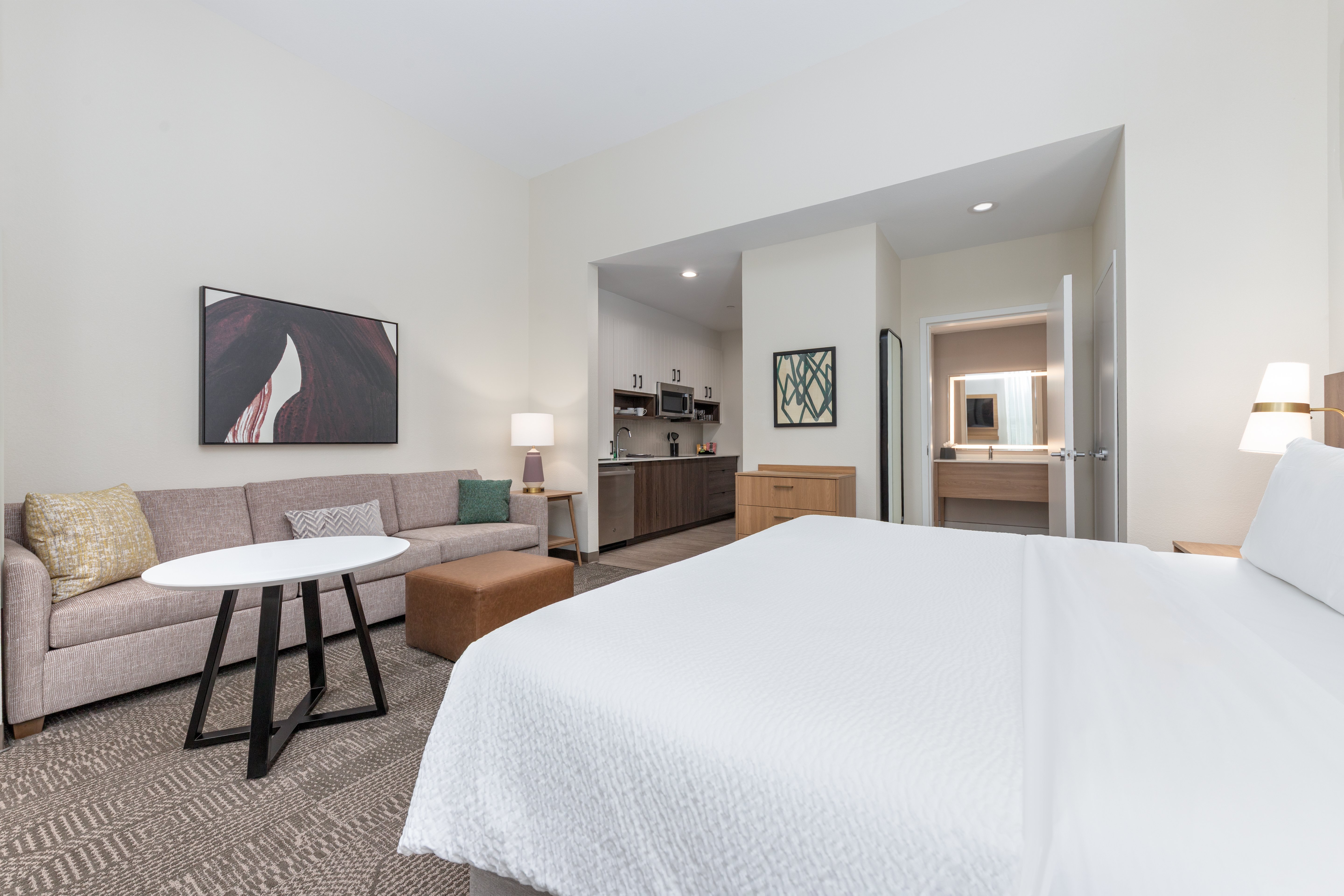 STAYBRIDGE STES PORT ARTHUR BY IHG-guestroom-Enjoy a spacious suite with a king bed and pull-out sofa..jpg