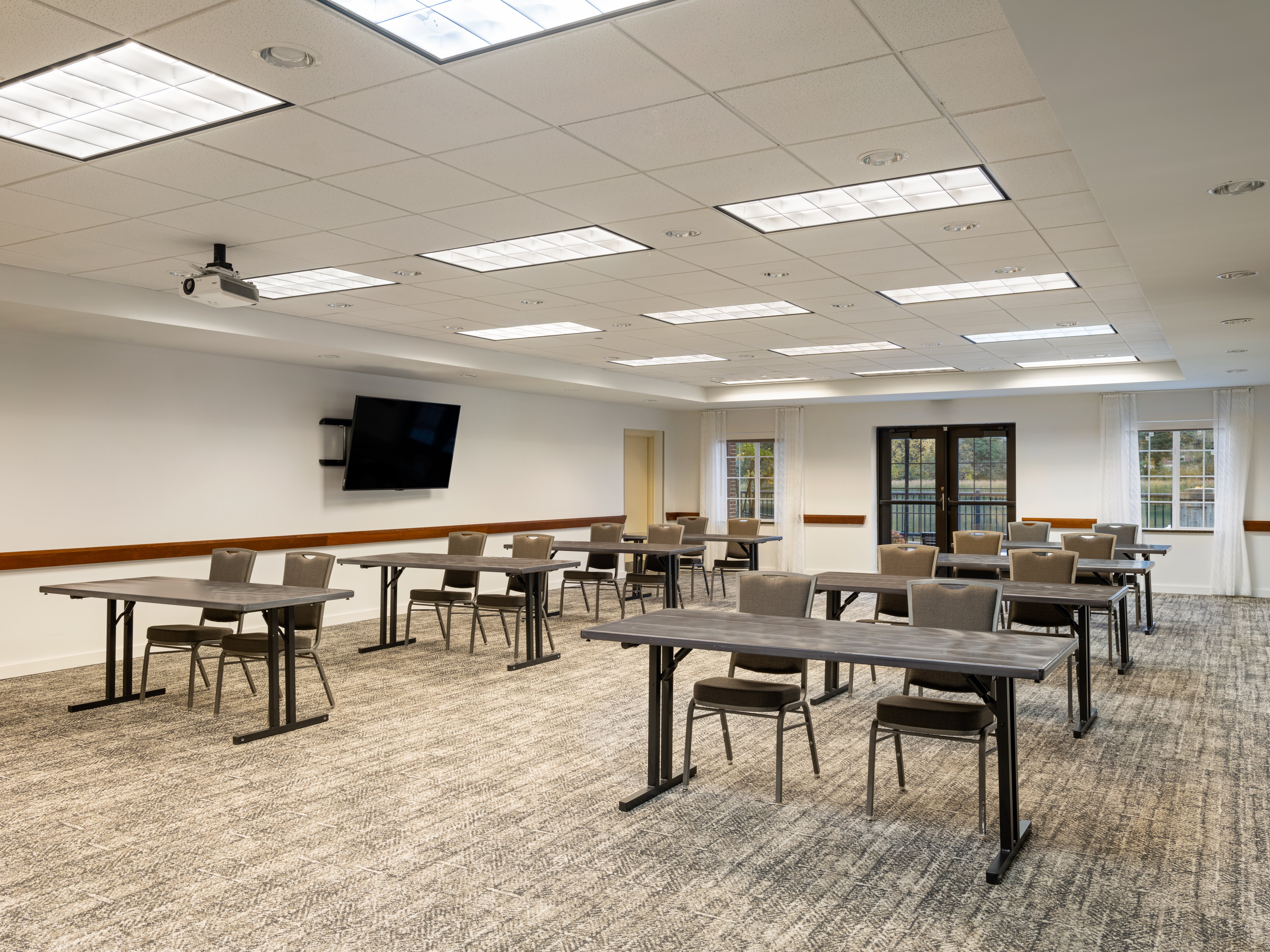 STAYBRIDGE STES ROCHESTER EAST BY I-guestroom-Our Rapids room can accommodate groups up to 125 attendees.jpg
