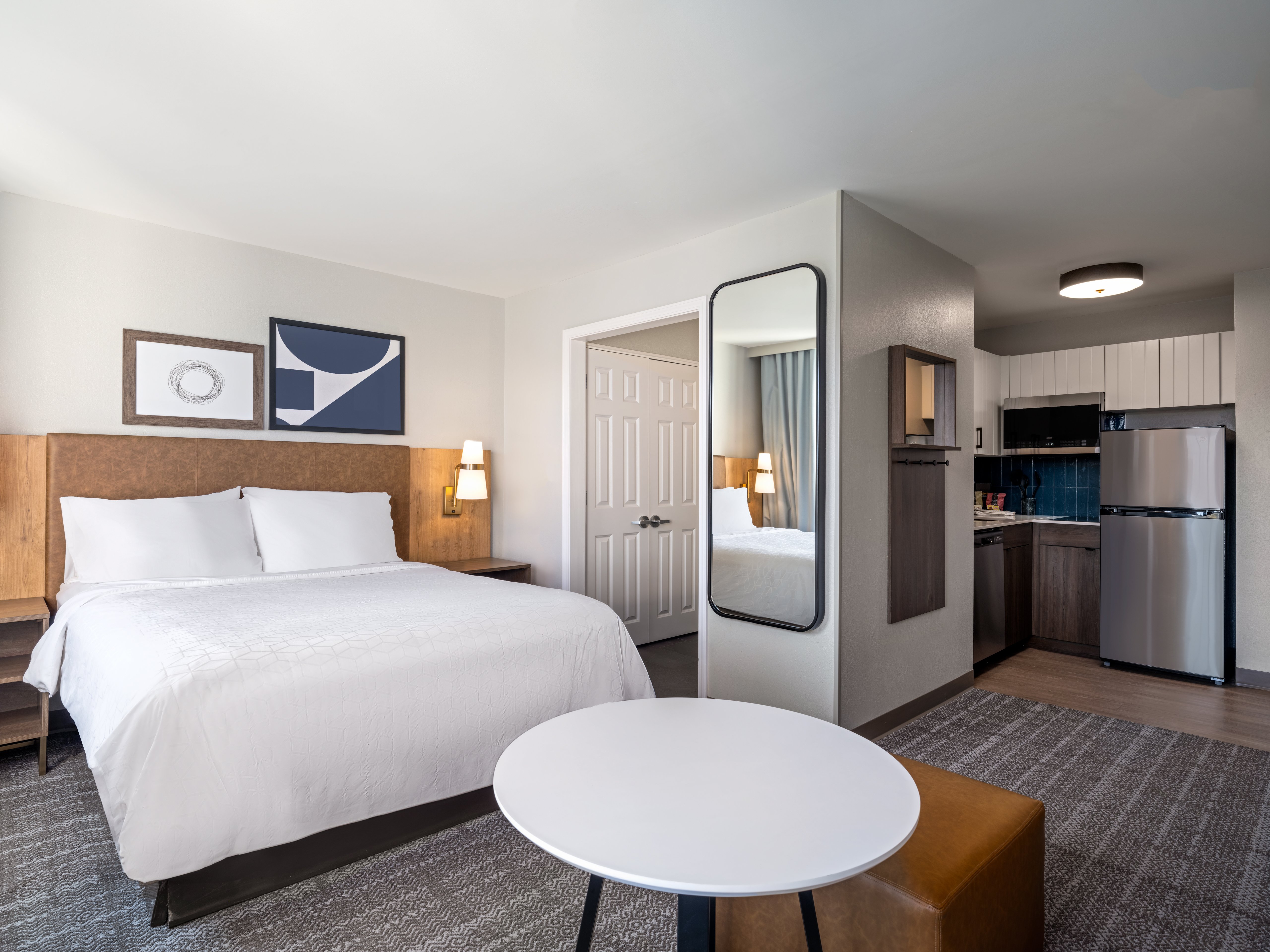 STAYBRIDGE STES ROCHESTER EAST BY I-guestroom-Open Concept Studio Suite with Kitchen, Queen Bed and Sofa Sleeper.jpg