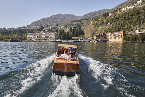 Driver And Guests On The Boat Villa D Este On The Background