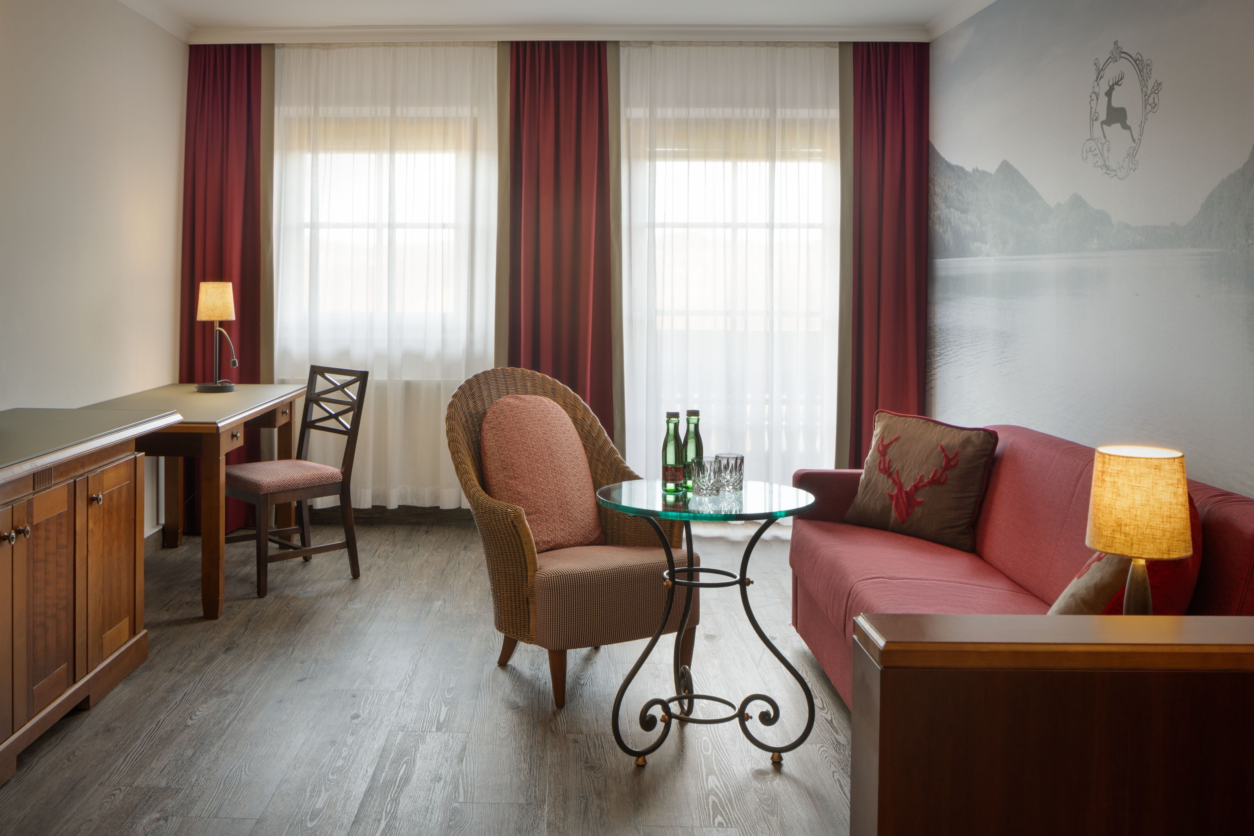 Arabella Jagdhof Resort am Fuschlsee a Tribute Portfolio Hotel-guestroom-Suite Living room.jpg