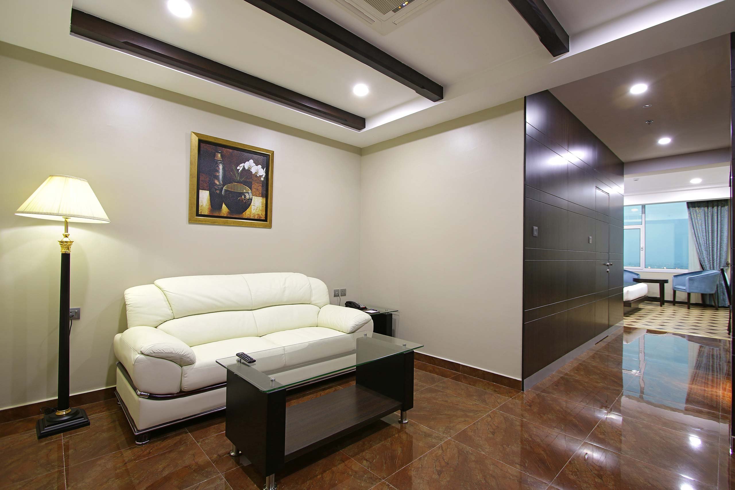 Park Regis Lotus-guestroom-JUNIOR SUITE LIVING ROOM.jpg