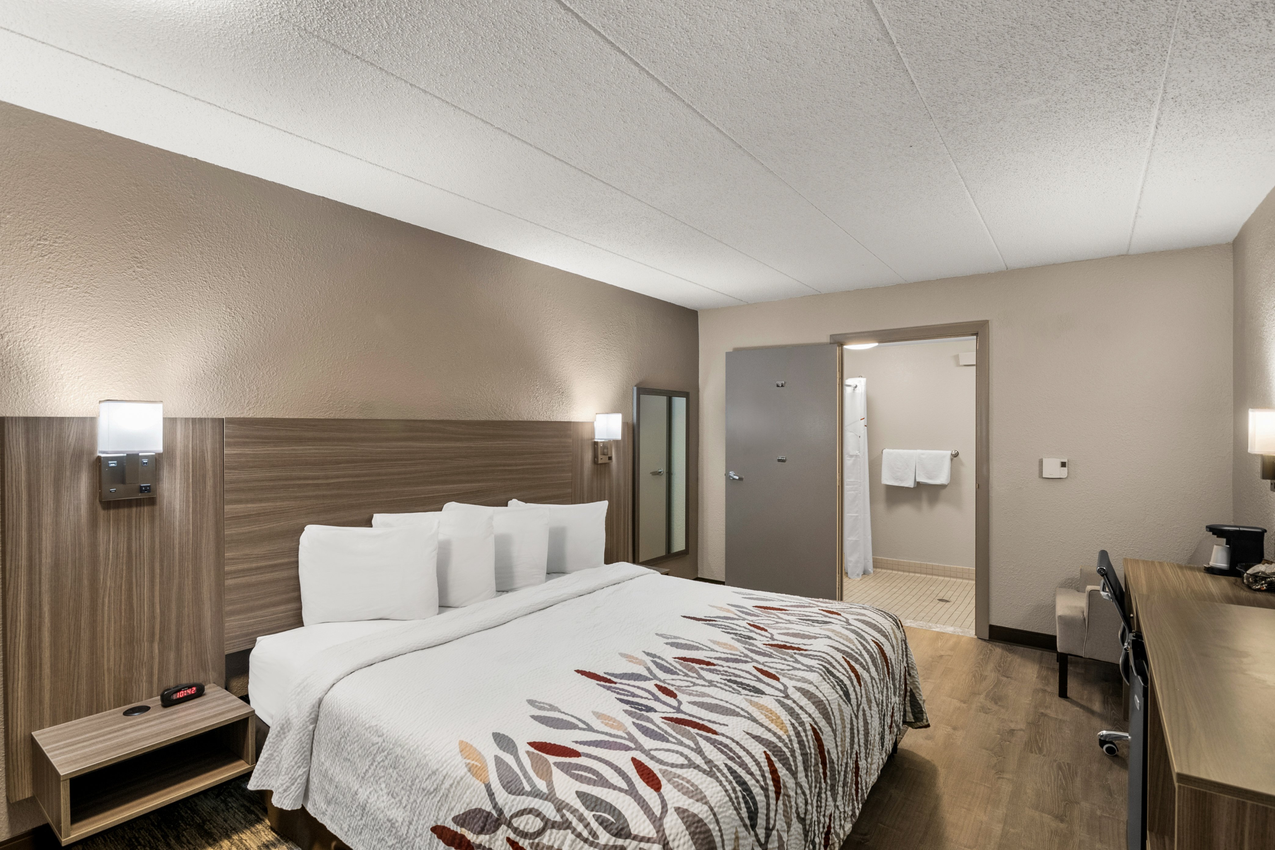 RED ROOF ENFIELD-guestroom-RRI NAPKR Nonsm Access Sup King Roll Shower Approved.jpg