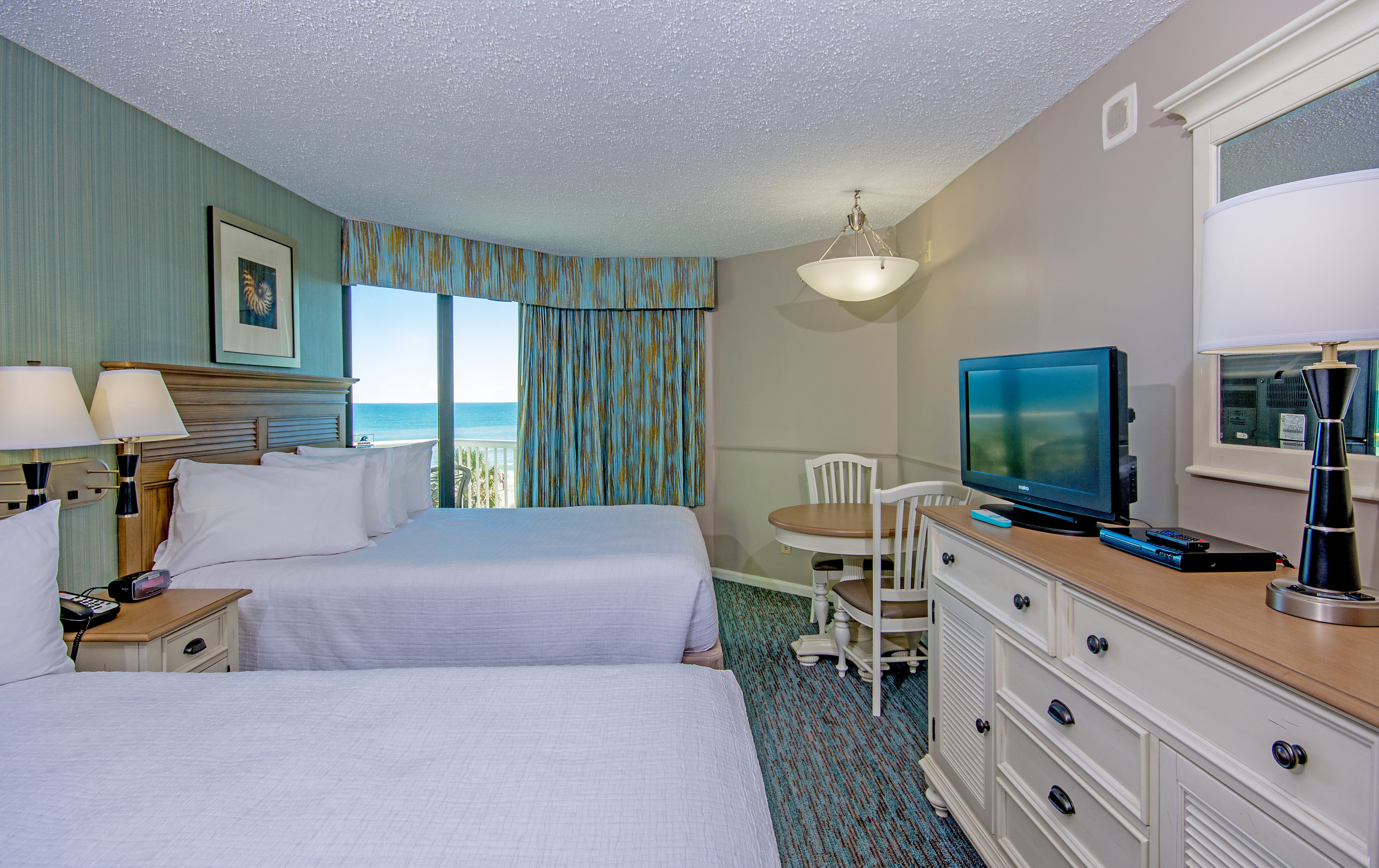The Strand-guestroom-the strand c oceanfront room bedroom ().jpg