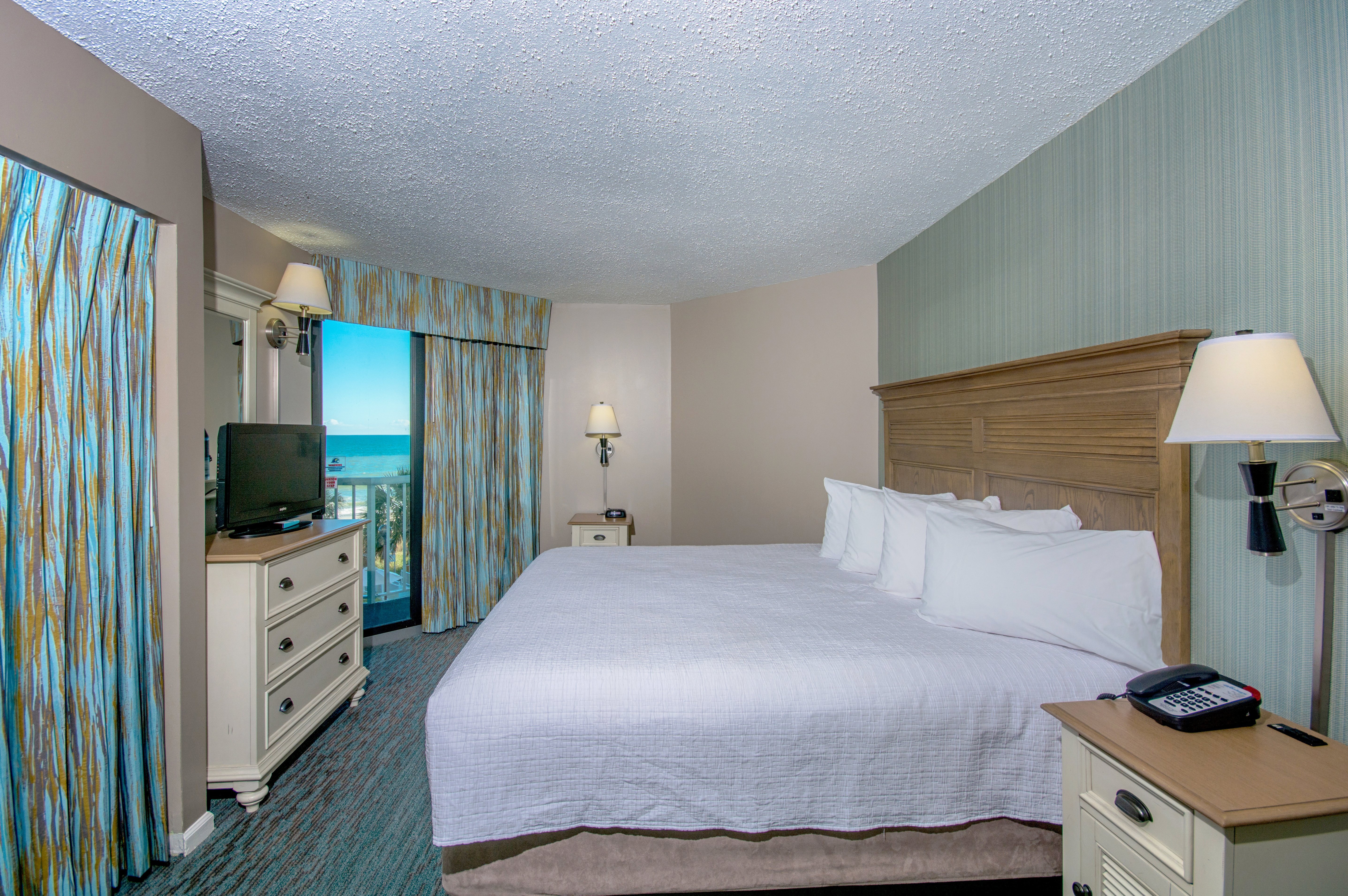 The Strand-guestroom-the strand d oceanfront king suite bedroom ().jpg