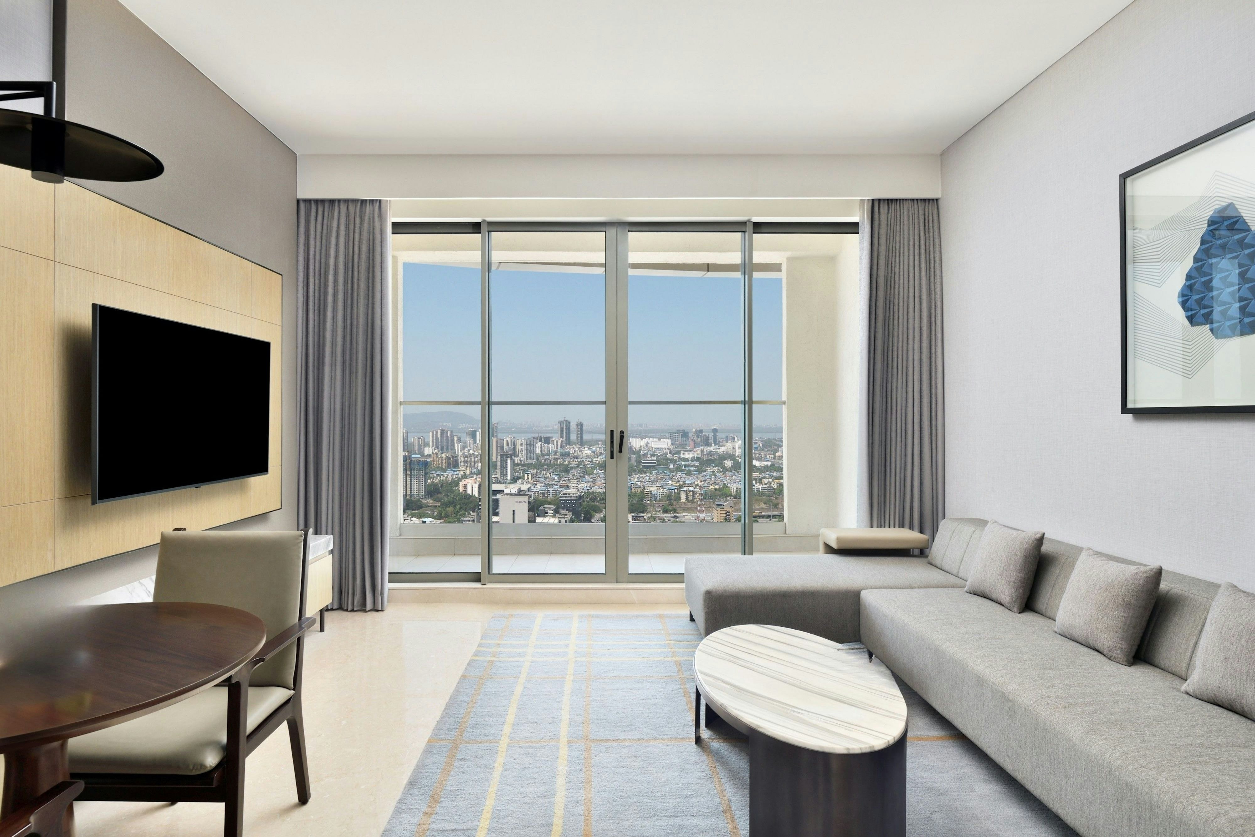 LE MRIDIEN NAVI MUMBAI-guestroom-King Luxury Suite Living Room.jpg