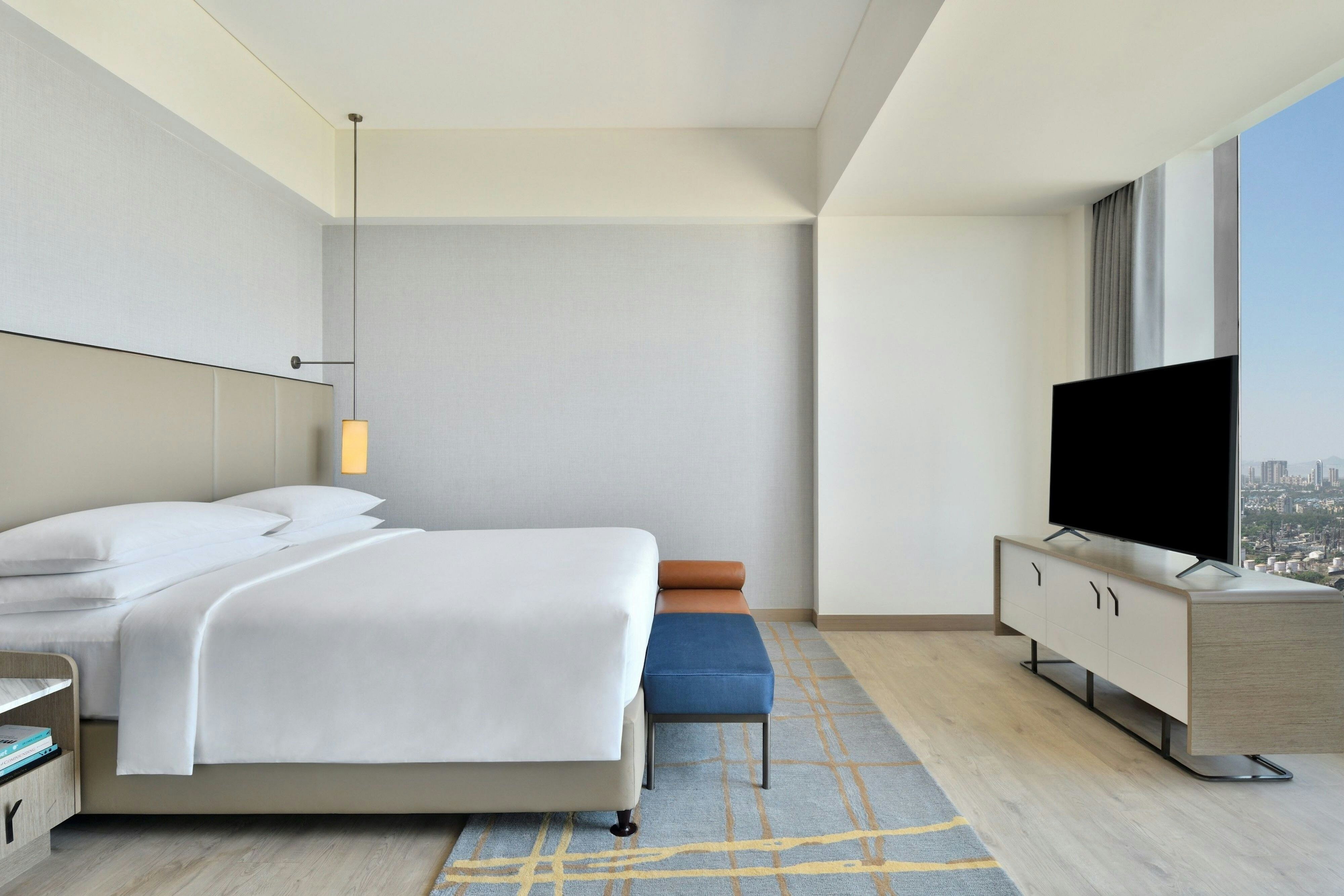 LE MRIDIEN NAVI MUMBAI-guestroom-King Luxury Suite Bedroom.jpg