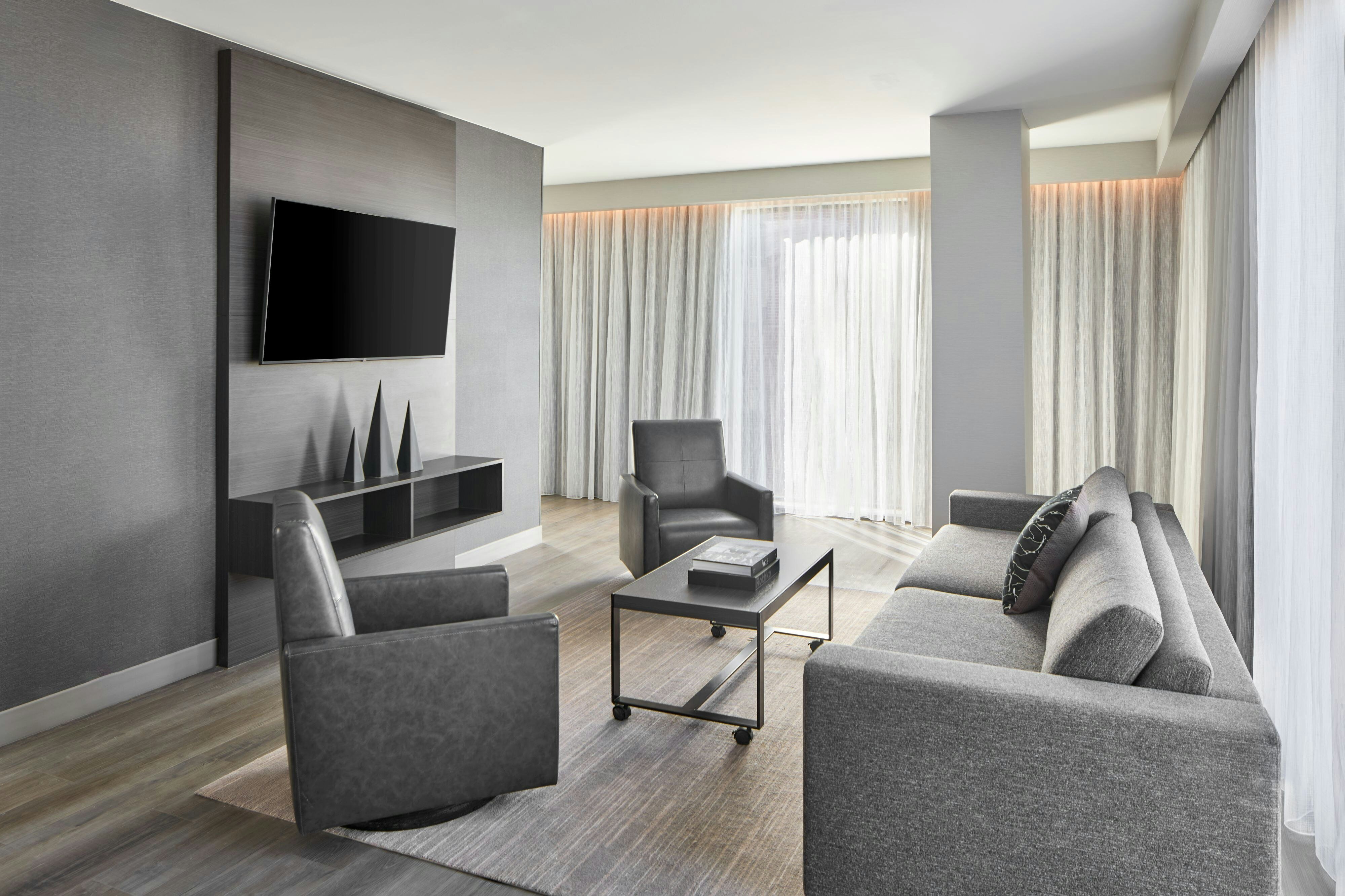 AC Hotels by Marriott Auburn-guestroom-King Suite Living Room.jpg