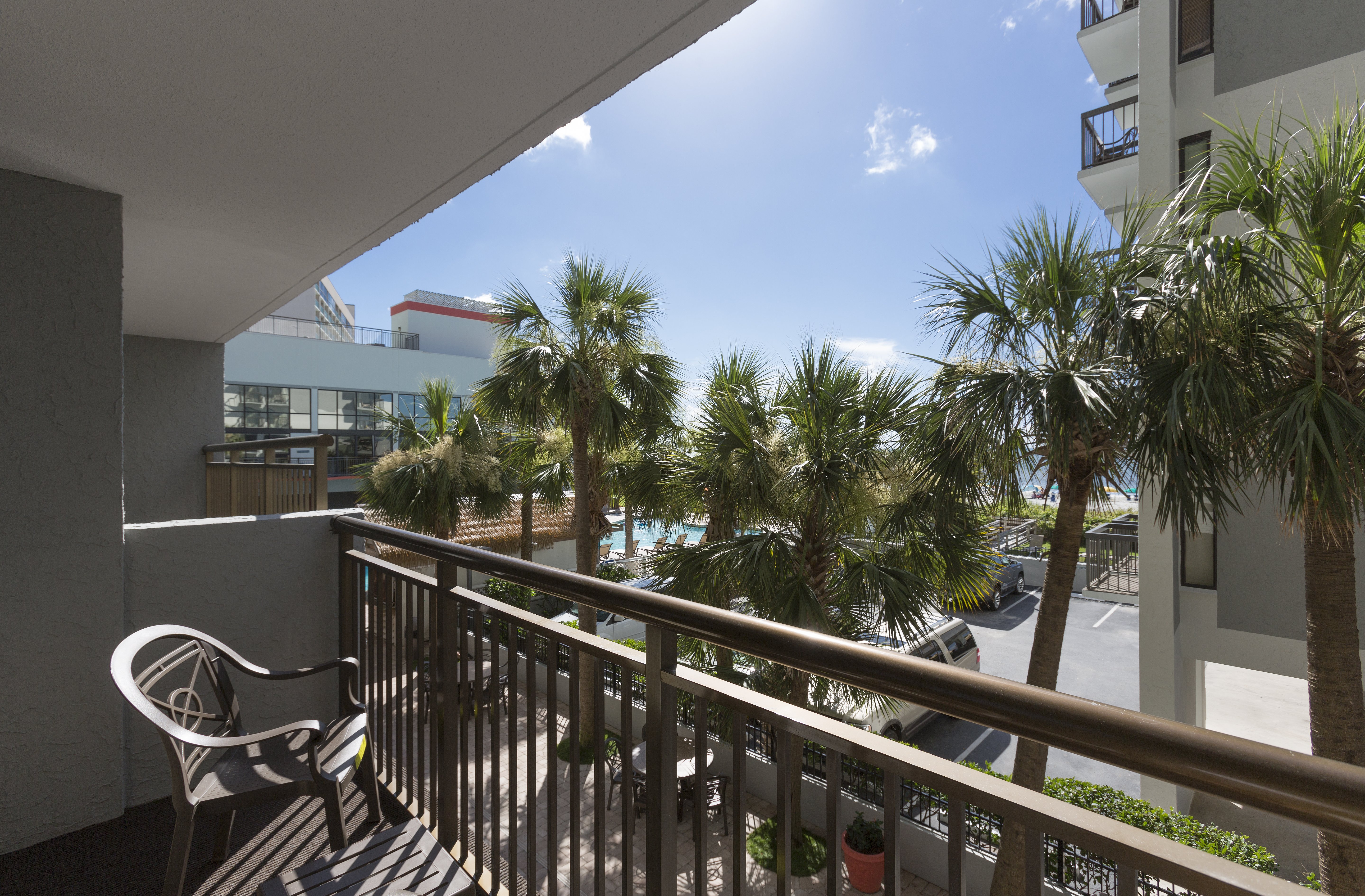 Grand Cayman Resort-guestroom-grande cayman partial view suite queen balcony ().jpg