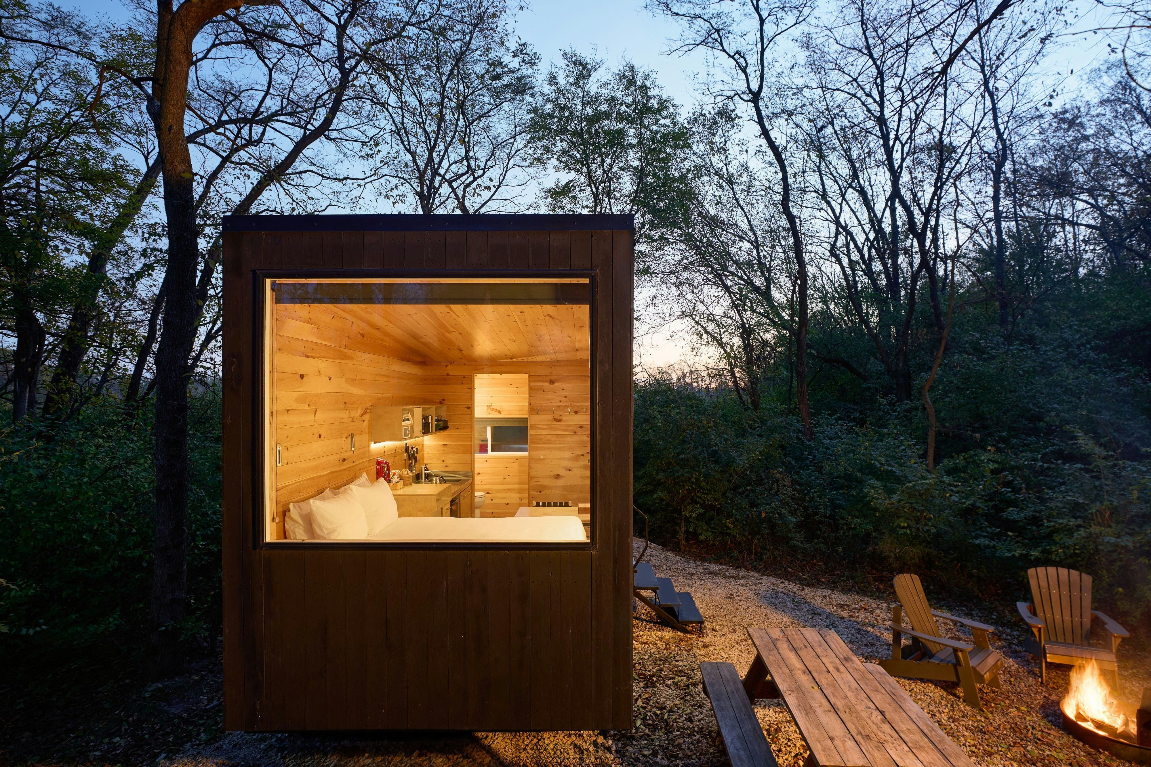POSTCARD CABINS GILCHRIST SPRING OU-guestroom-Single cabin nighttime glow.jpg