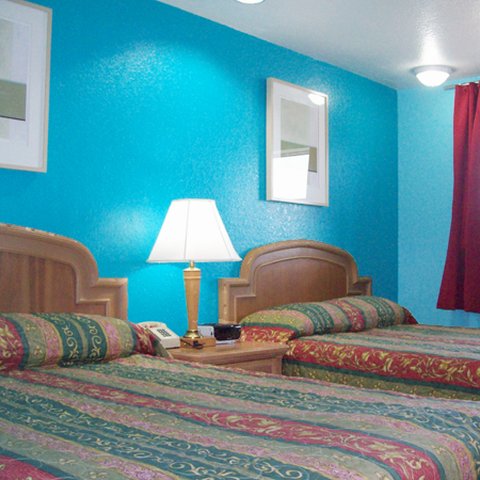 Economy Lodge by Hotel O Texas-guestroom-Economy Lodge Texas City TXBed.jpg