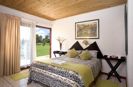 AIRPORT GAME LODGE-guestroom-Room.jpg