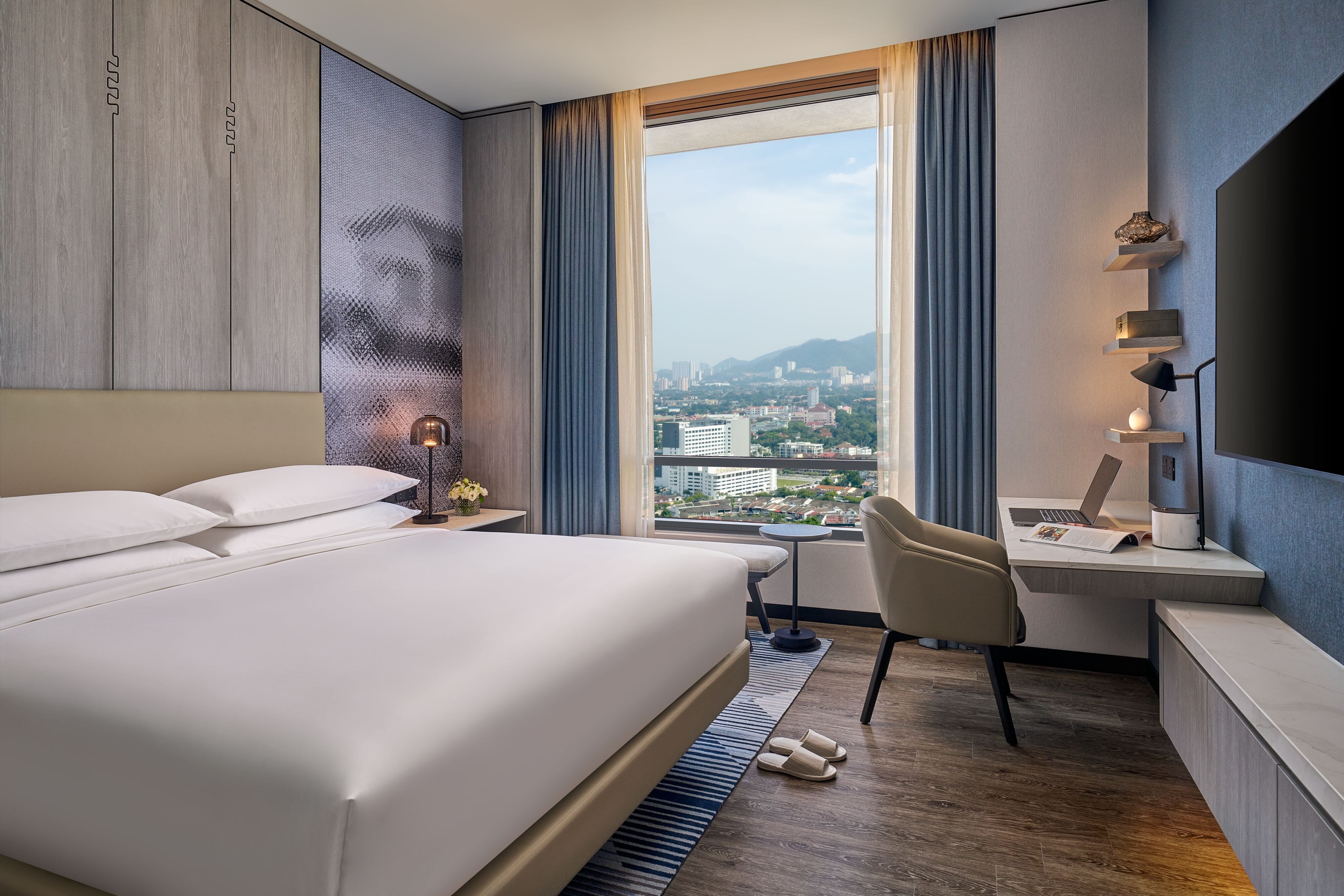 Marriott Executive Apartments Penang-guestroom-King bed with work desk for work and relaxation.jpg