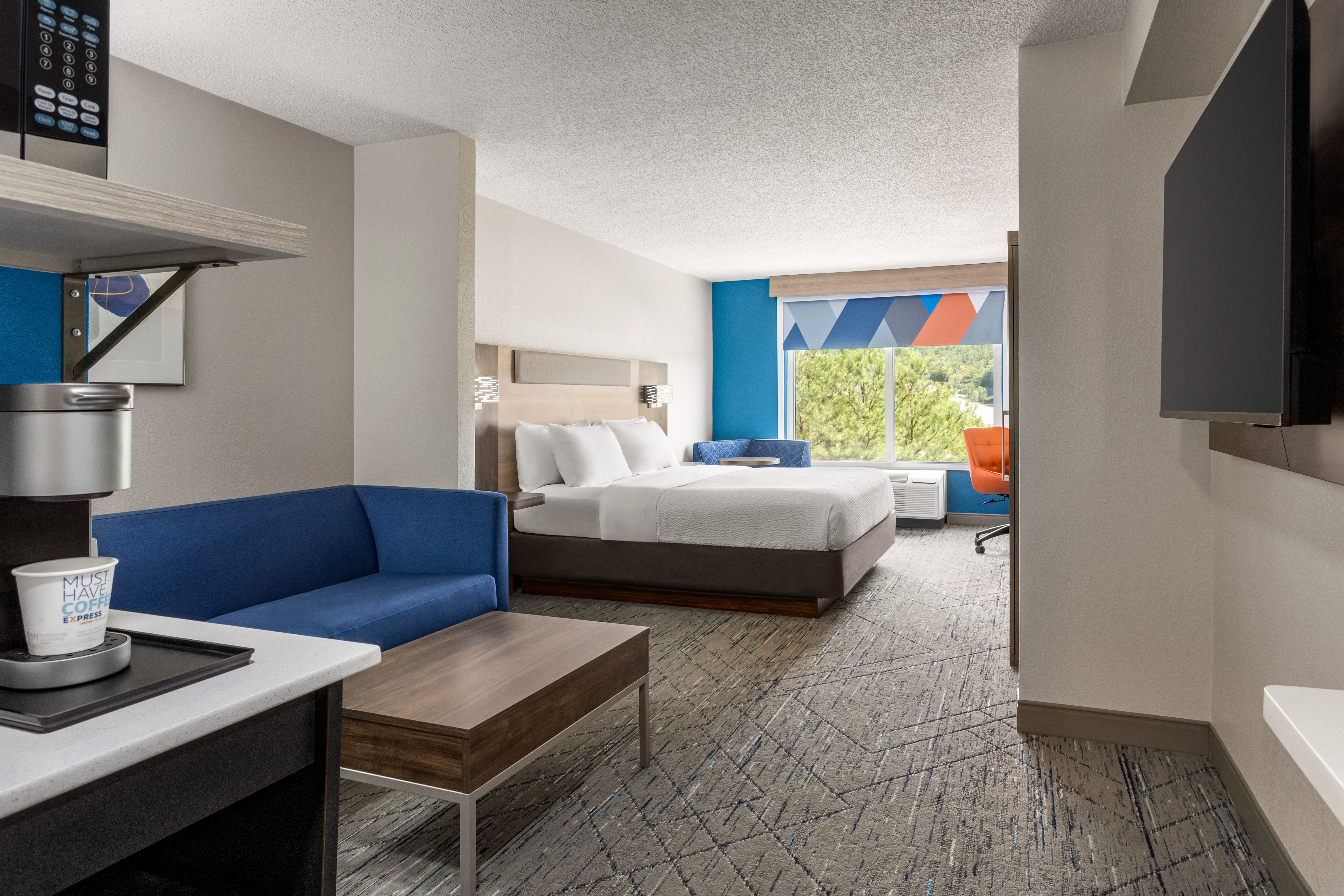HOLIDAY INN EXP HTLS AND STES-guestroom-King Suite.jpg