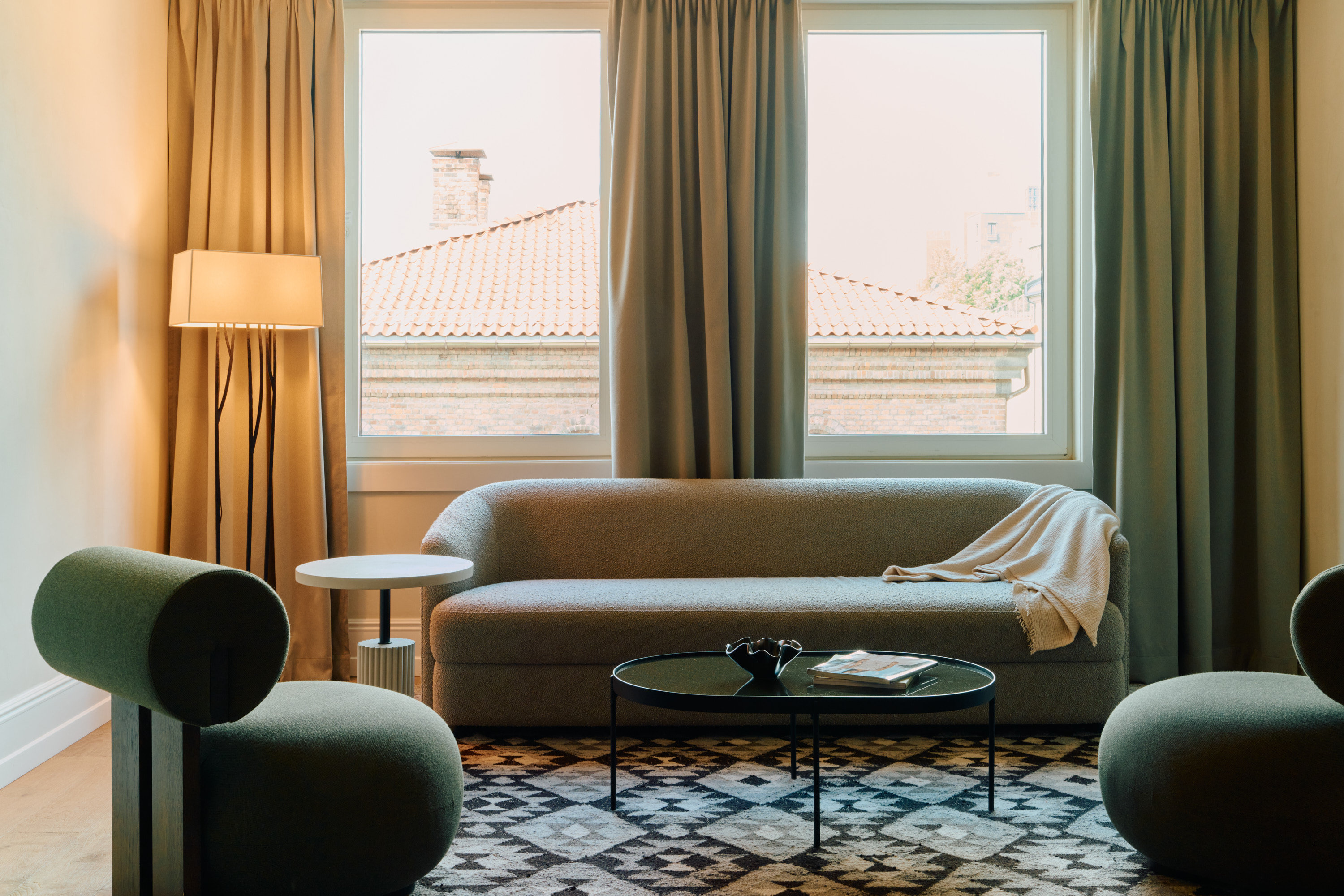 REVIER-guestroom-Att Kvadraturen Deluxe Suite With City View AV.jpg