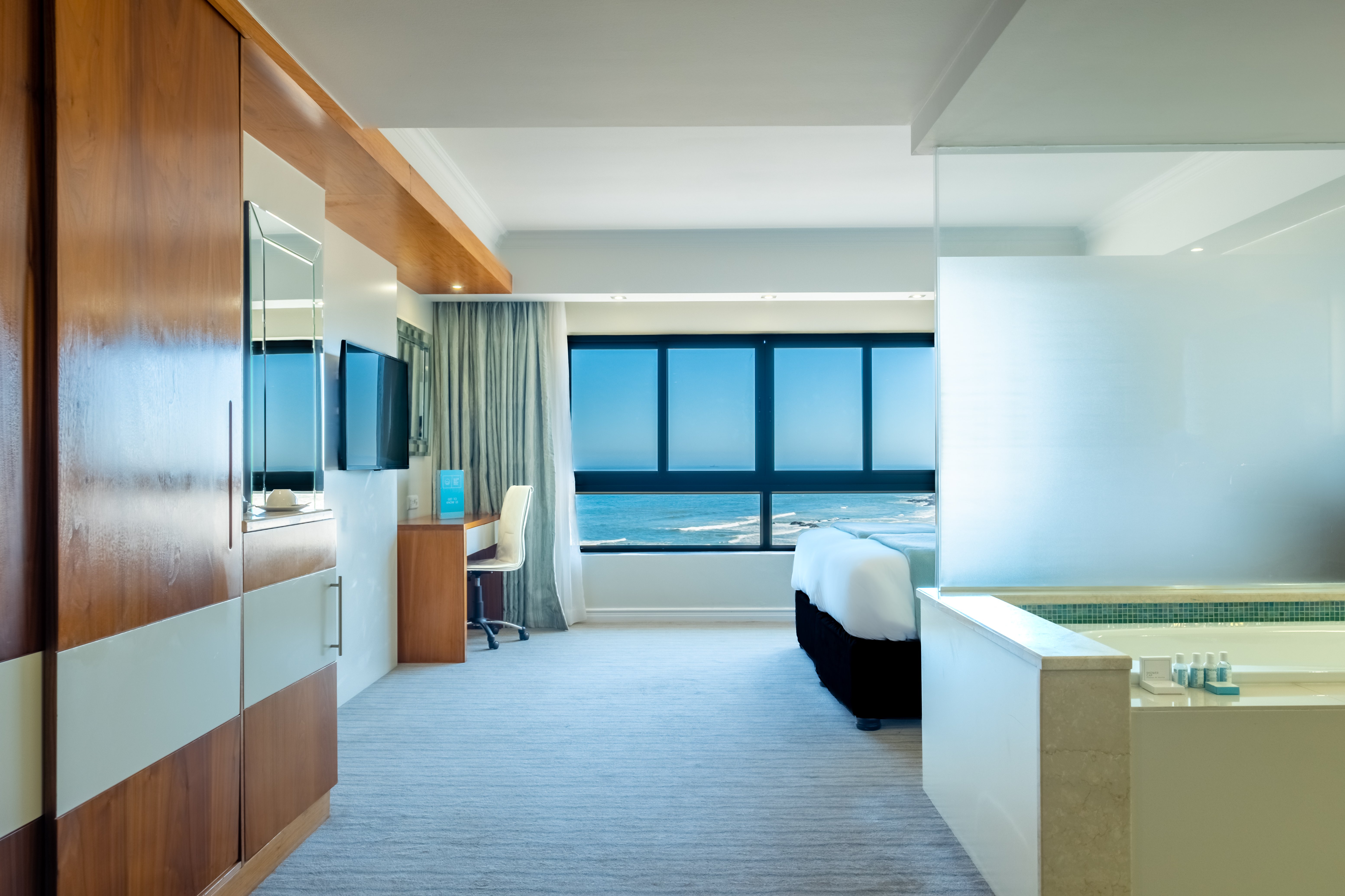 BLAAUWBERG BEACH HOTEL-guestroom-Sea Facing Robben Island Twin With Bathtub.jpg