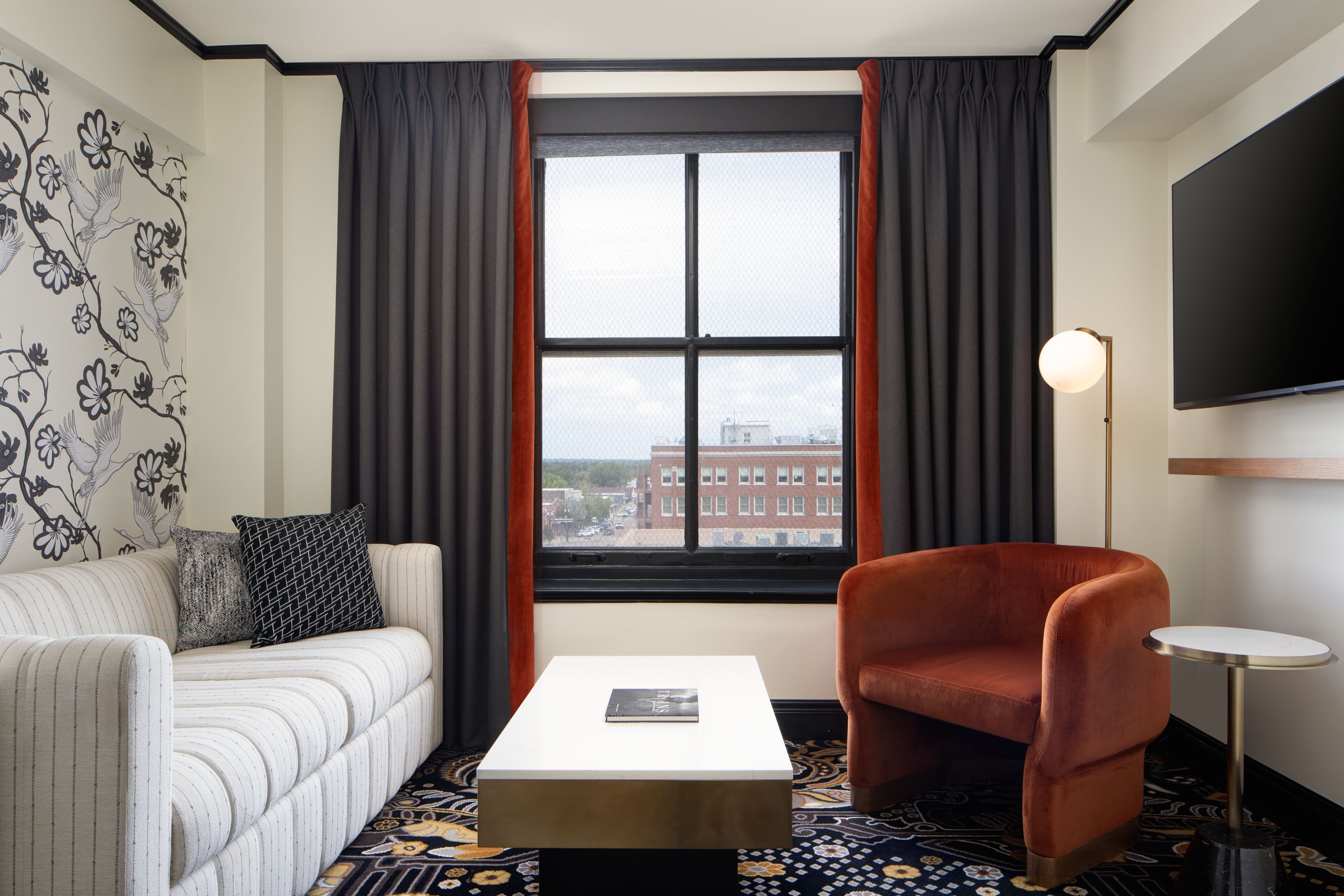 The LaSalle Hotel Bryan College Station a Tribute Portfolio Hotel-guestroom-Queen Suite Living Room.jpg