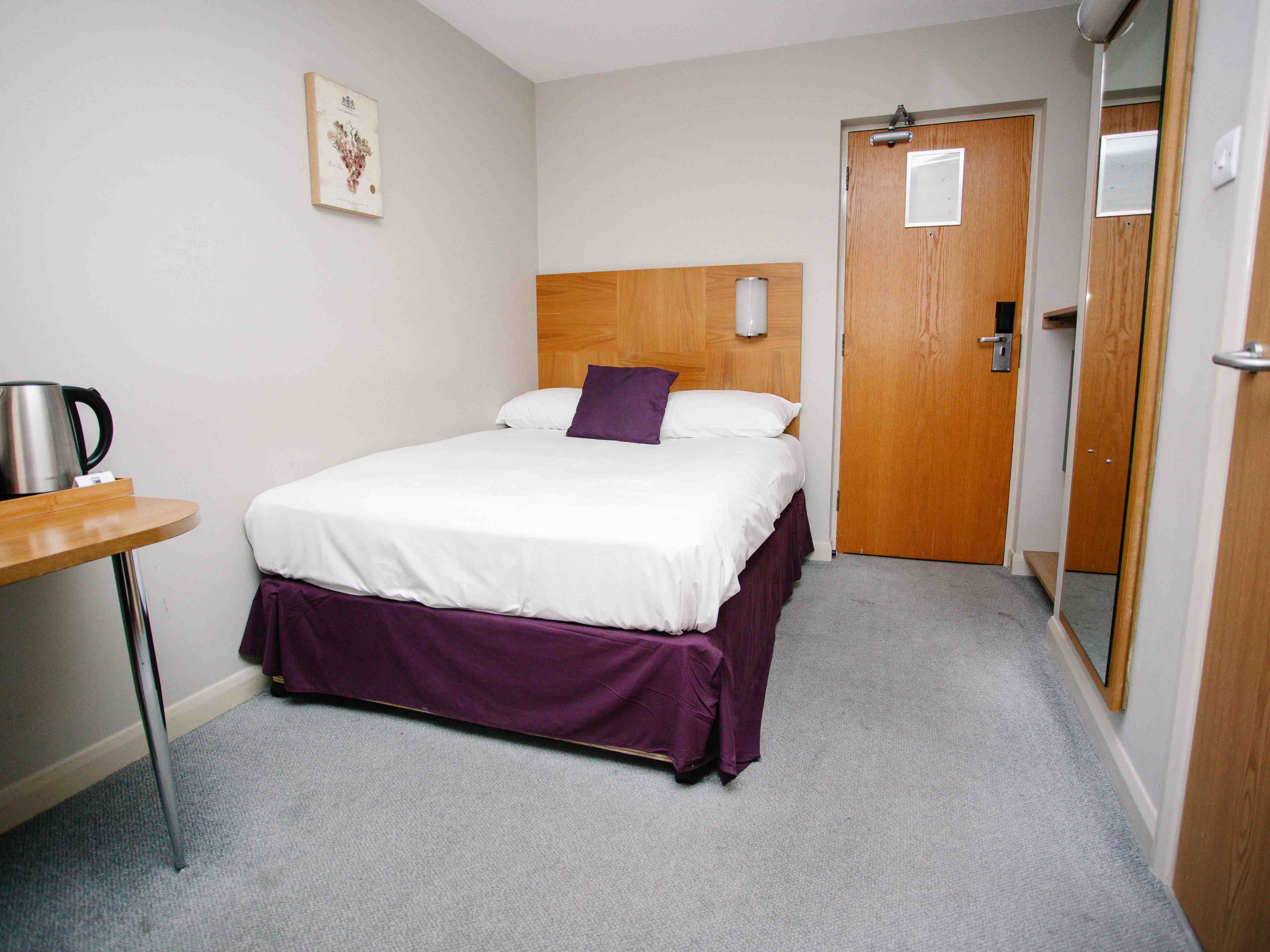 Corner House Hotel-guestroom-SMALL DOUBLE SINGLE OCCUPANCY BED.jpg