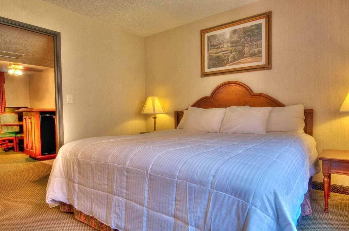 MCM Elegante Suites-guestroom-King Suite Bedroom.jpg