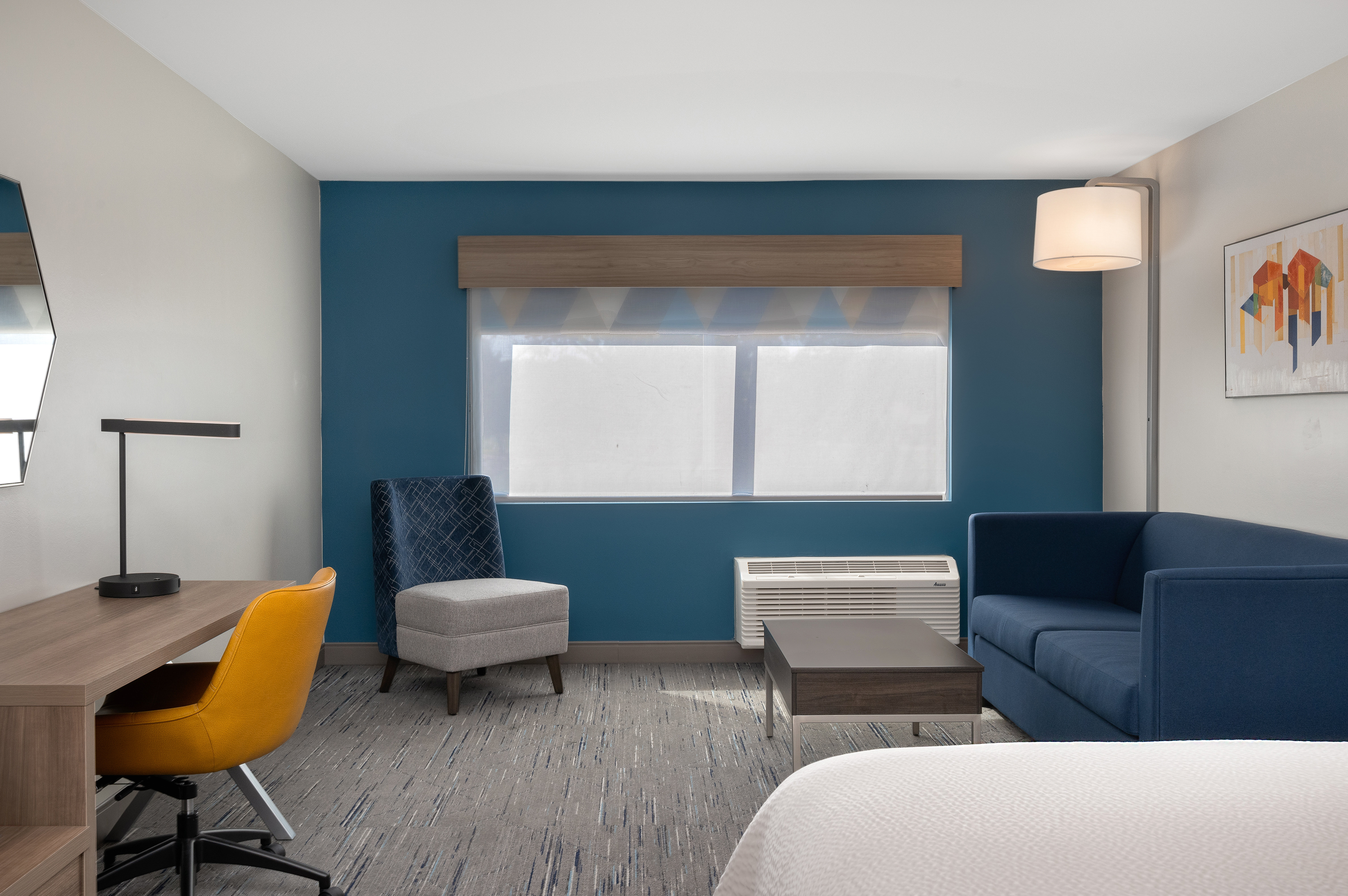 HOLIDAY INN EXP STES ALTON BY IHG-guestroom-King suite with sofa.jpg