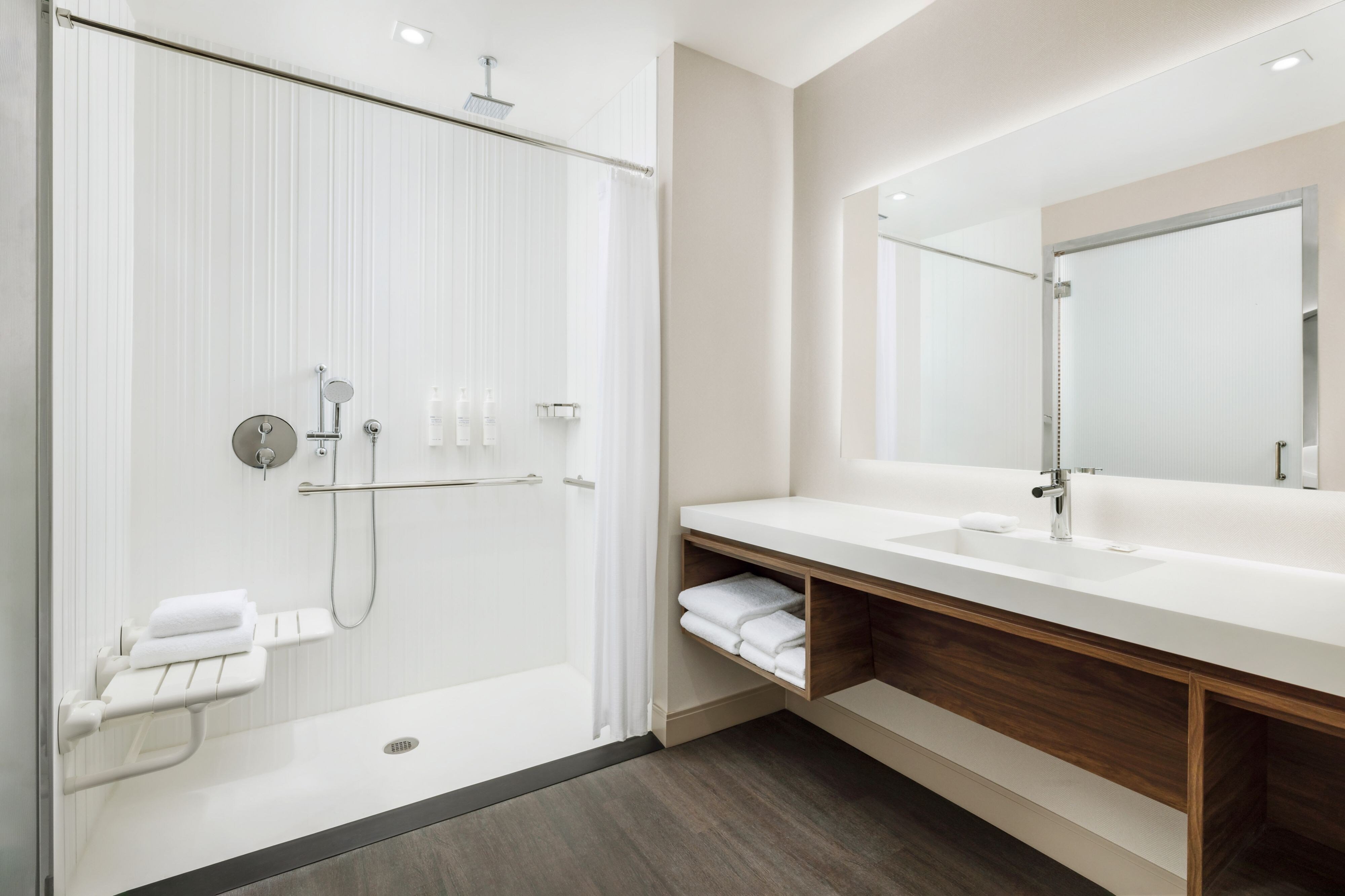 AC Hotels by Marriott Newtown Square-guestroom-Accessible Guest Bathroom - Roll-in Shower.jpg