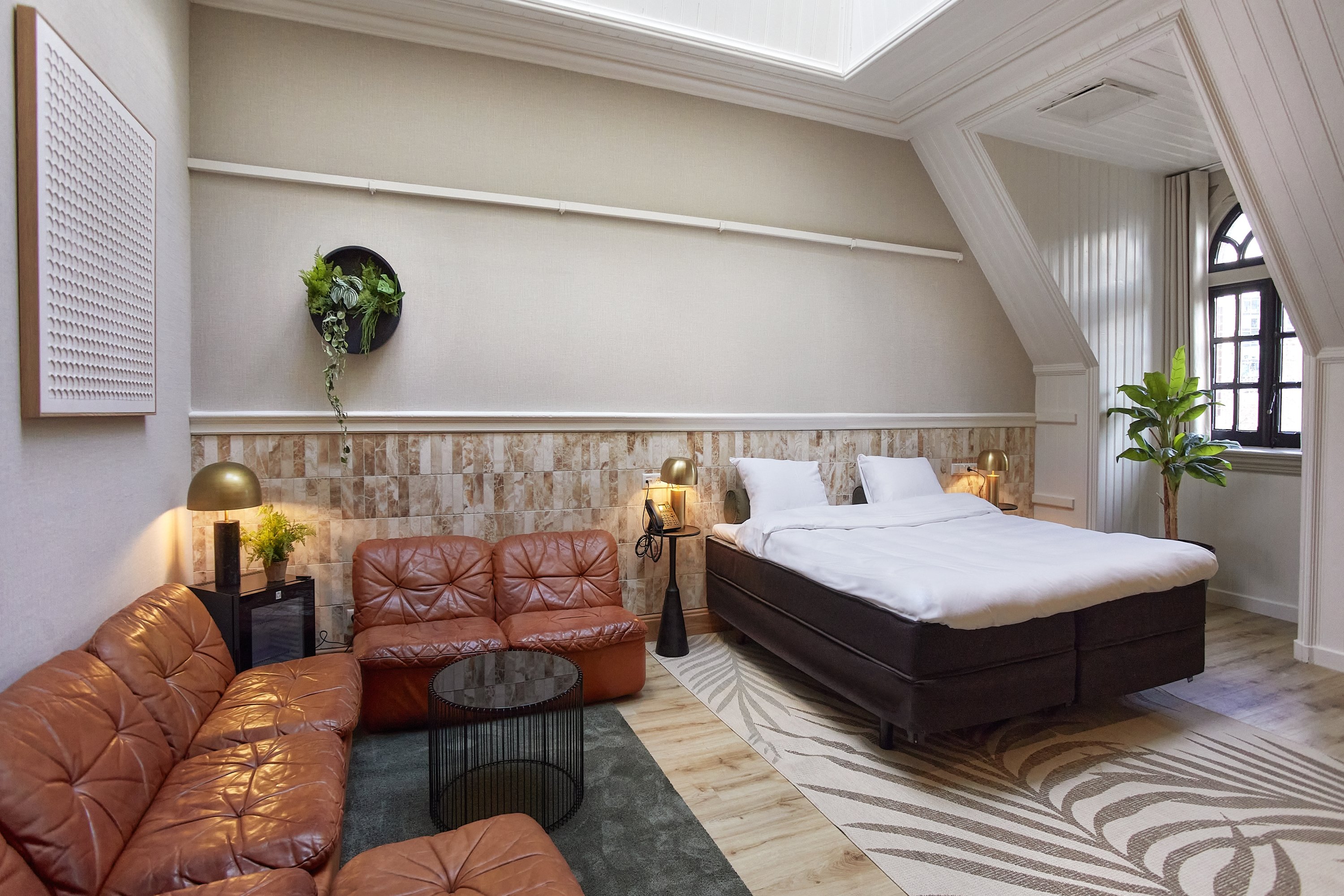Botanique Breda-guestroom-Brown Suite Sitting Area.jpg