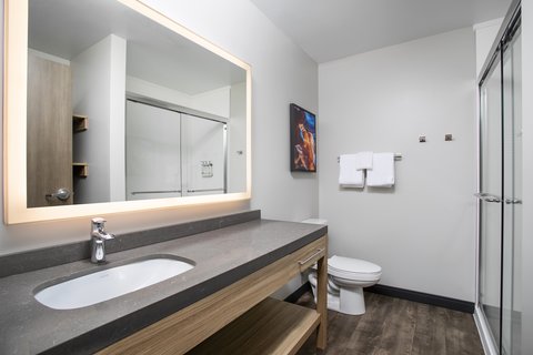 Start your day in a well-lit bathroom with ample counter space.
