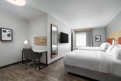 Two queen beds, a kitchen, and work areaâgreat for families.
