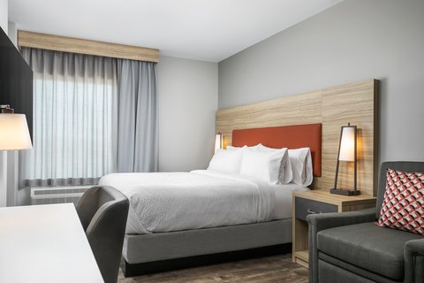 Rest easy in a king bed with plush linens, perfect for unwinding.