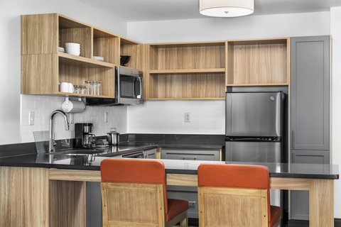 Fully equipped kitchen with counter seating and more.