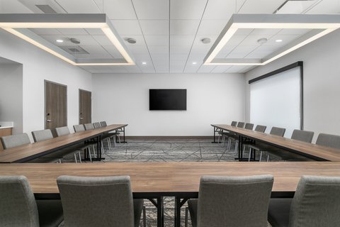 Flexible meeting space with modern amenities for small gatherings.