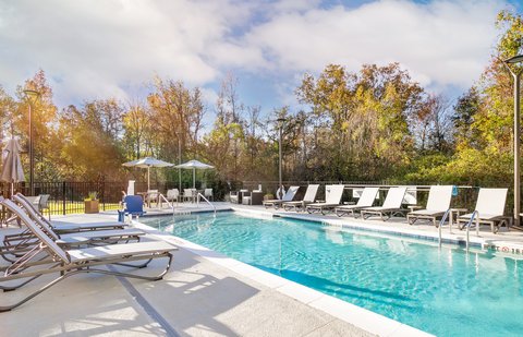 Unwind with a refreshing dip in the outdoor swimming pool.