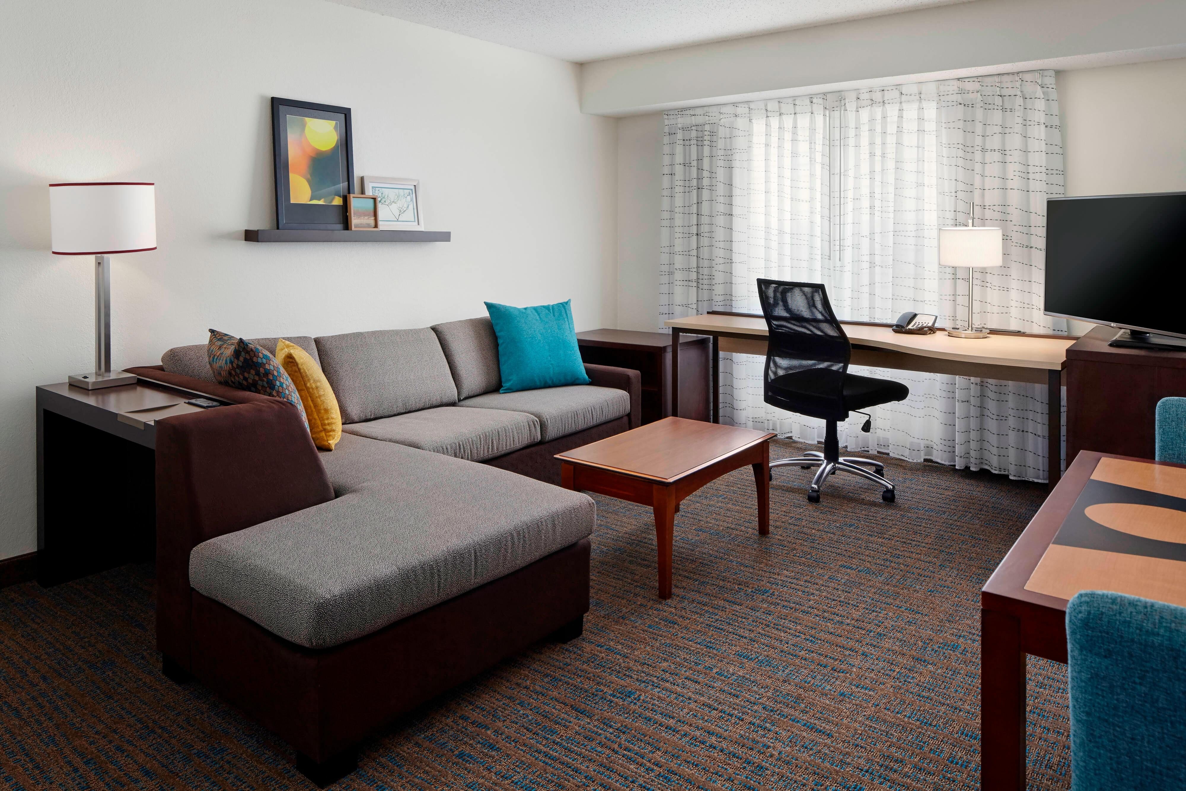 Residence Inn by Marriott St Louis Airport Earth City-guestroom-Queen Studio Suite Living Area.jpg