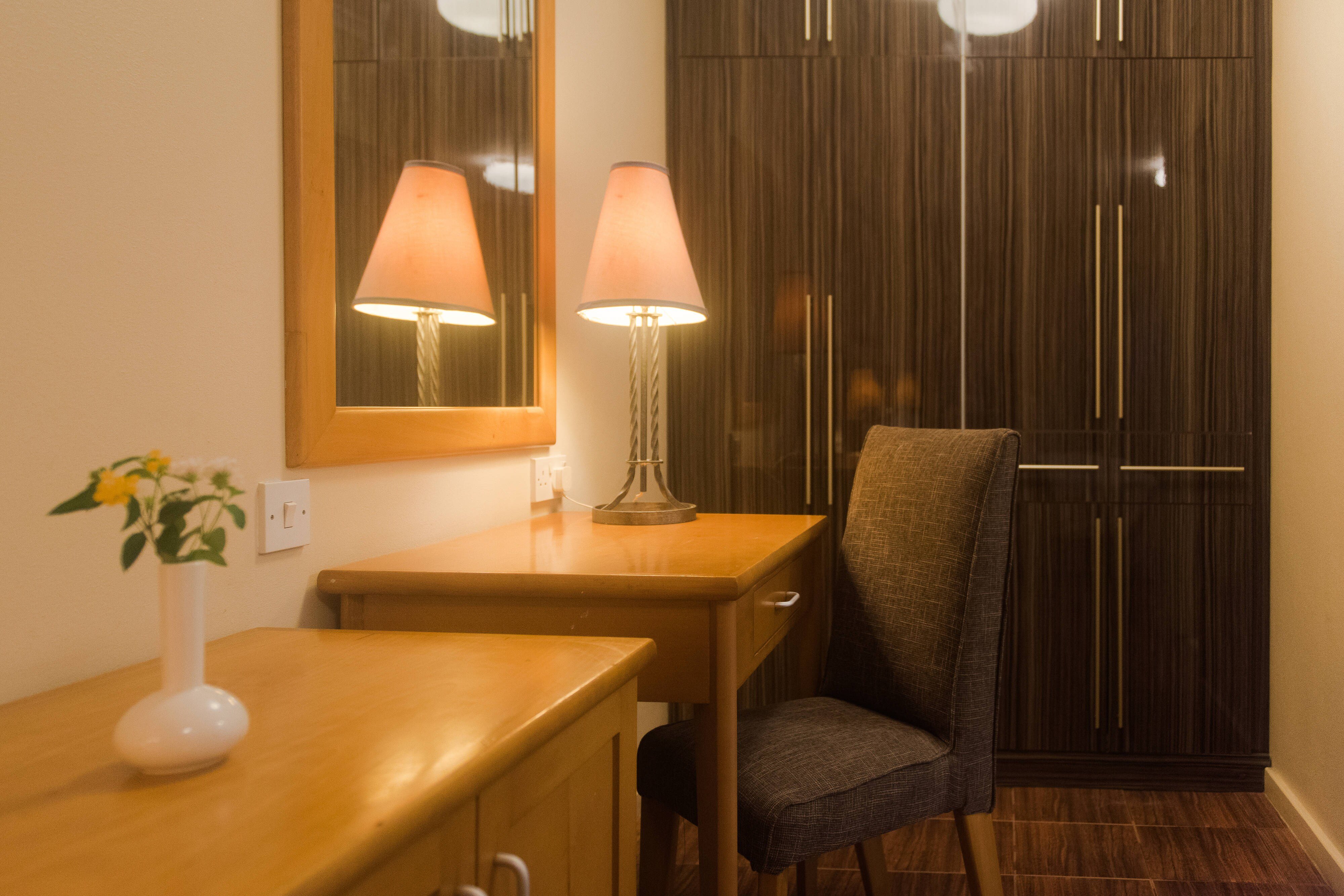 Protea Hotel by Marriott Dar es Salaam Oyster Bay-guestroom-One-Bedroom Queen Suite - Work Desk.jpg