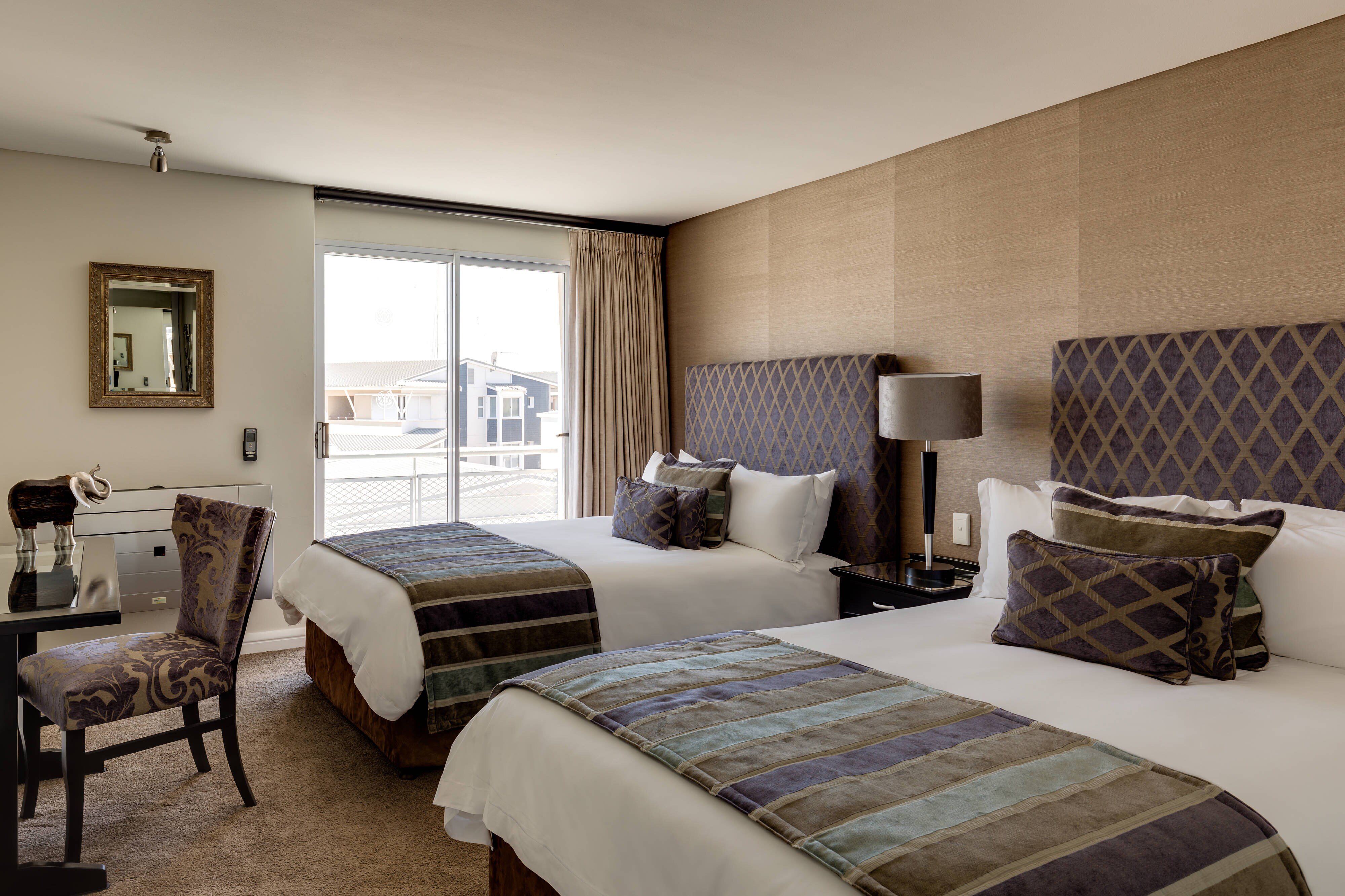 Protea Hotel by Marriott Knysna Quays-guestroom-Executive Three-Bedroom Suite - Bedroom One.jpg