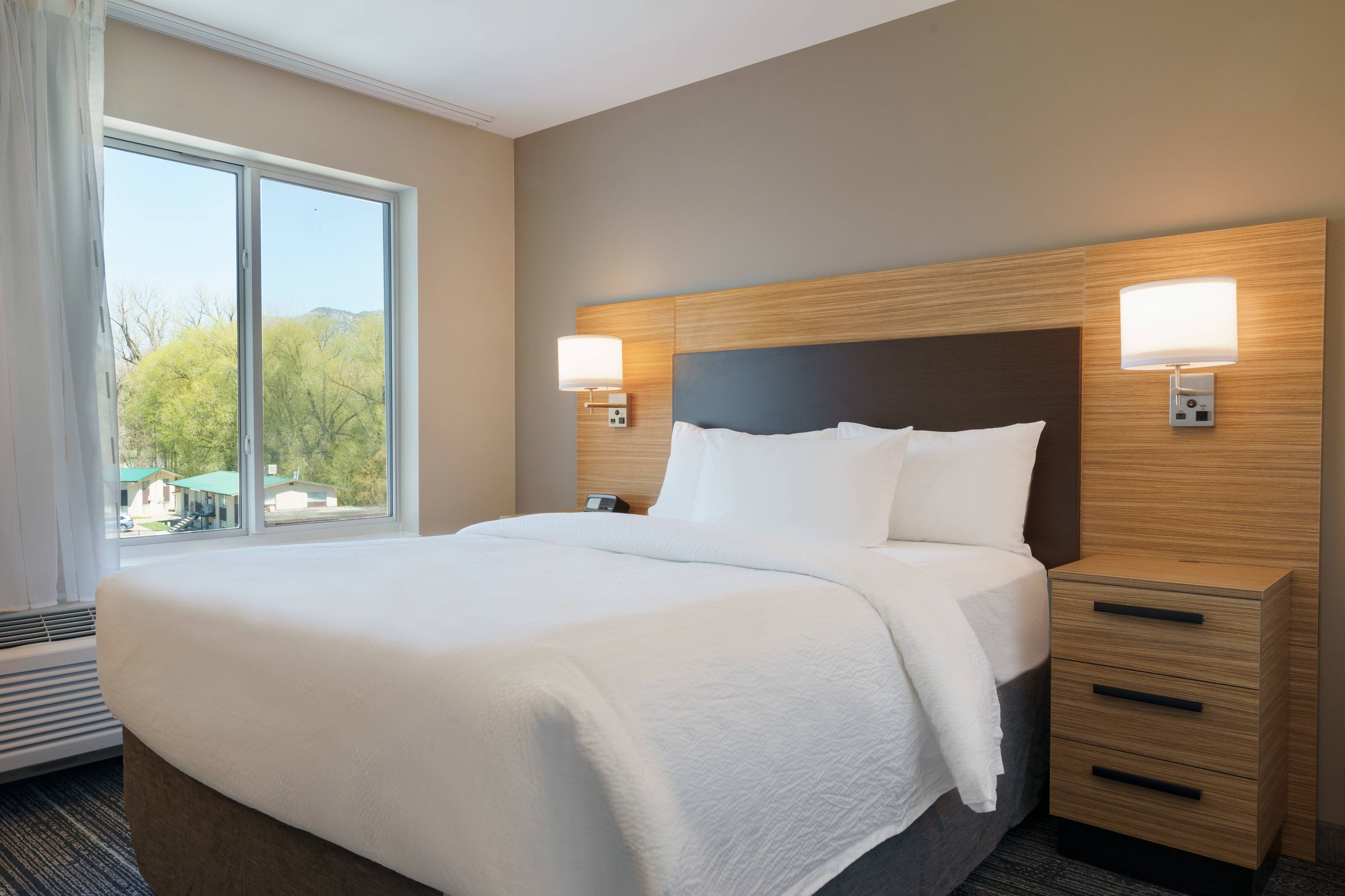 TownePlace Suites by Marriott Logan-guestroom-Queen Corner One-Bedroom Suite - Sleeping Area.jpg
