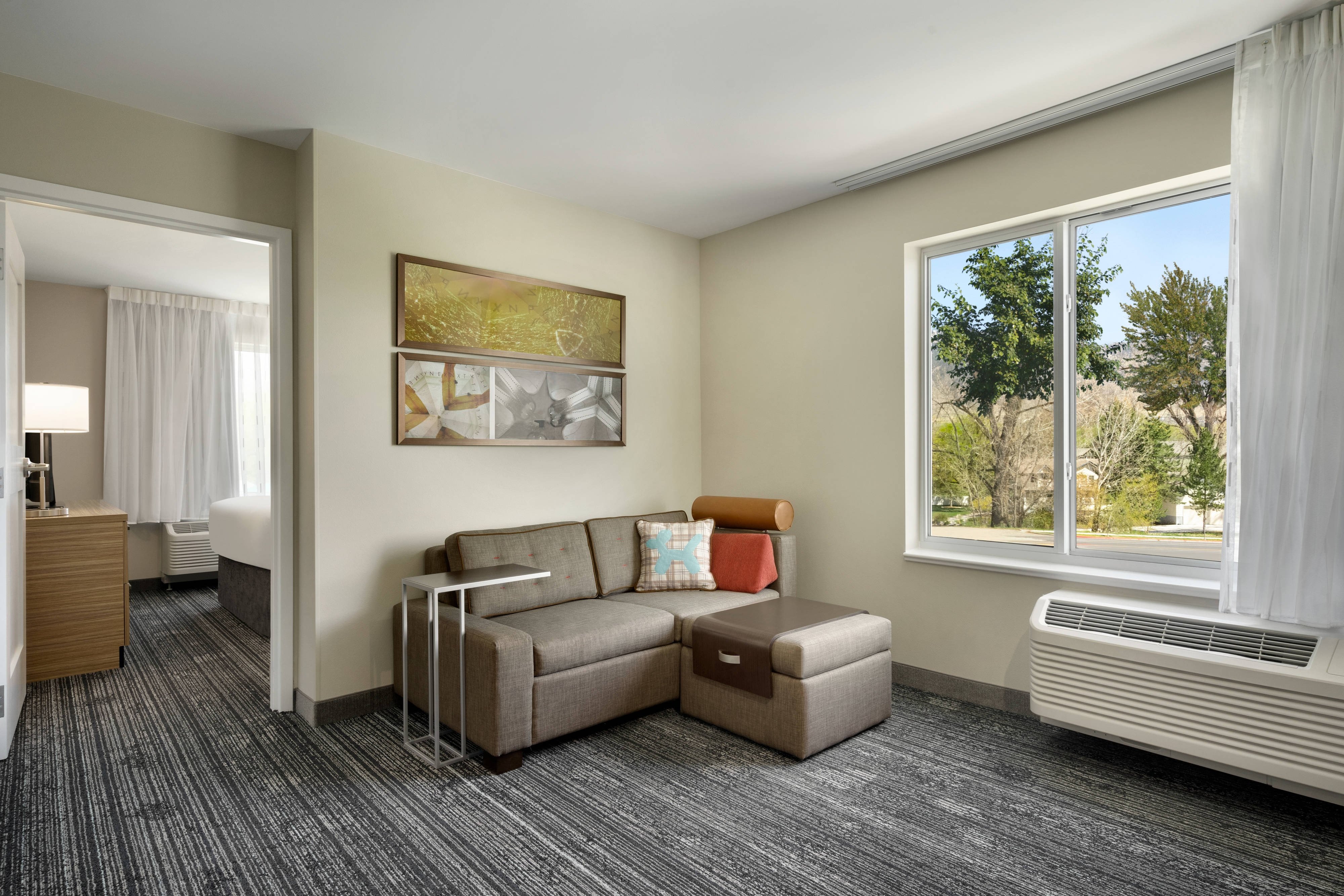 TownePlace Suites by Marriott Logan-guestroom-Queen Corner One-Bedroom Suite - Living Area.jpg
