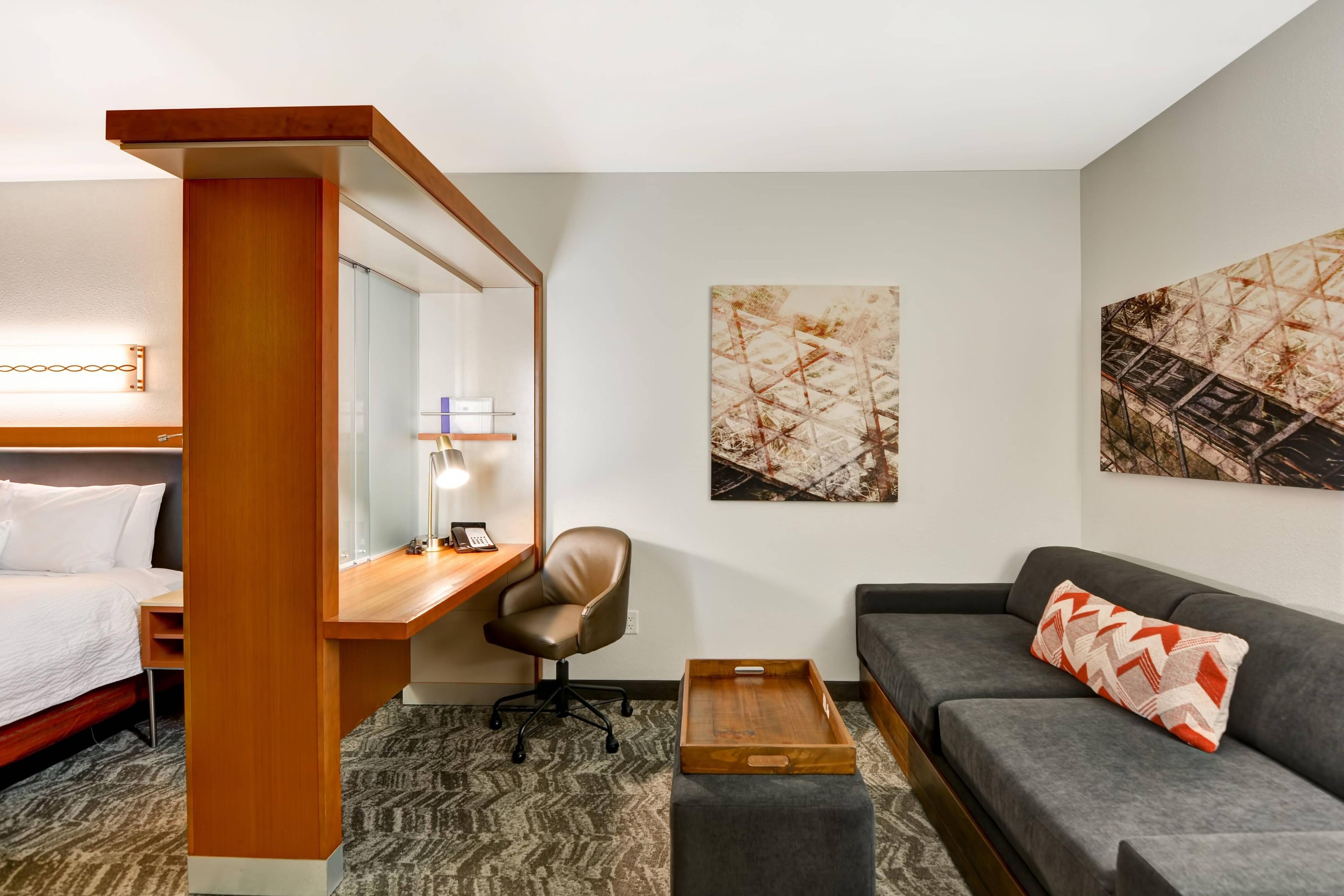SpringHill Suites Denver at Anschutz Medical Campus-guestroom-Suite- Living Area.jpg