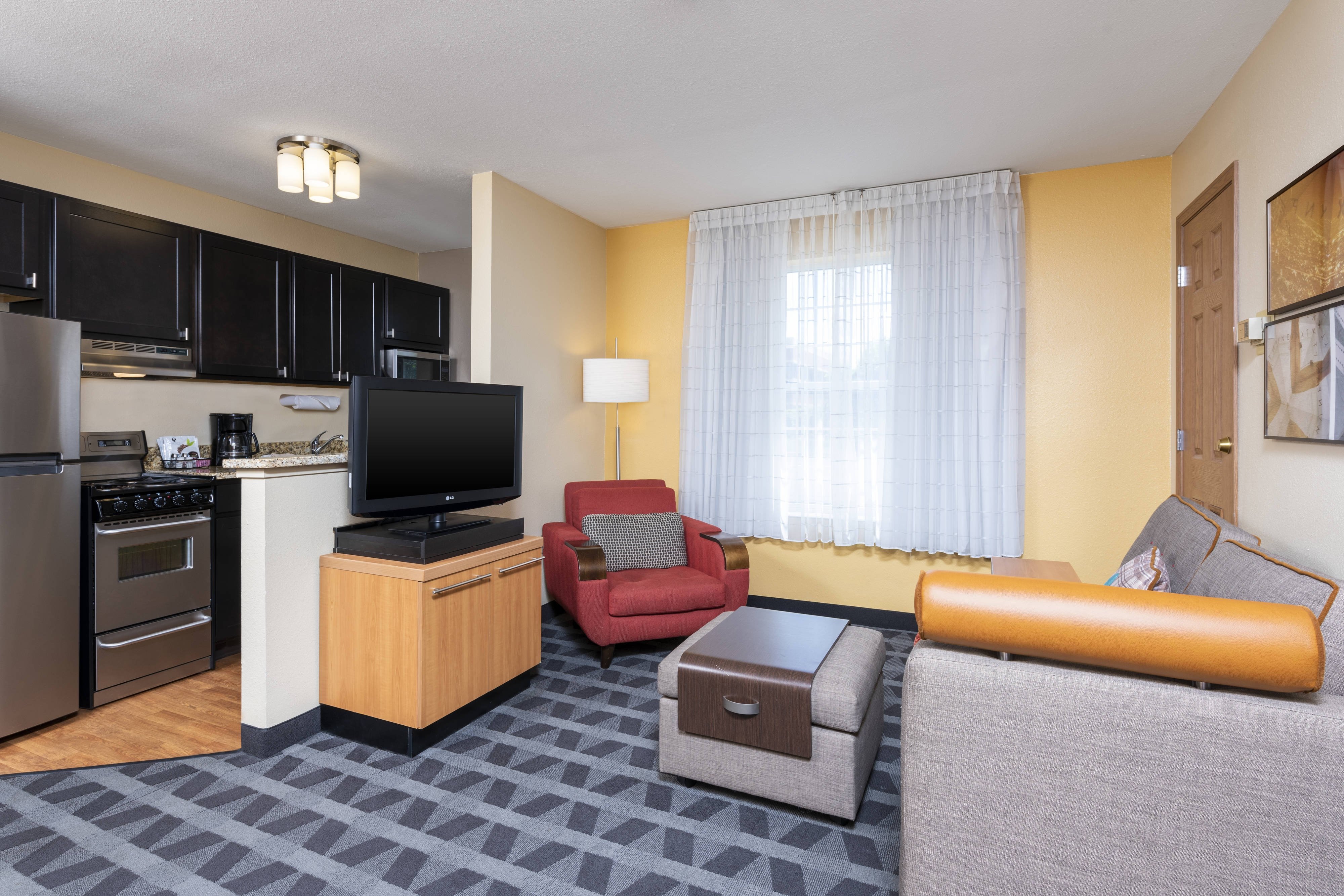 TownePlace Suites by Marriott East Lansing-guestroom-One-Bedroom Suite - Living Area.jpg