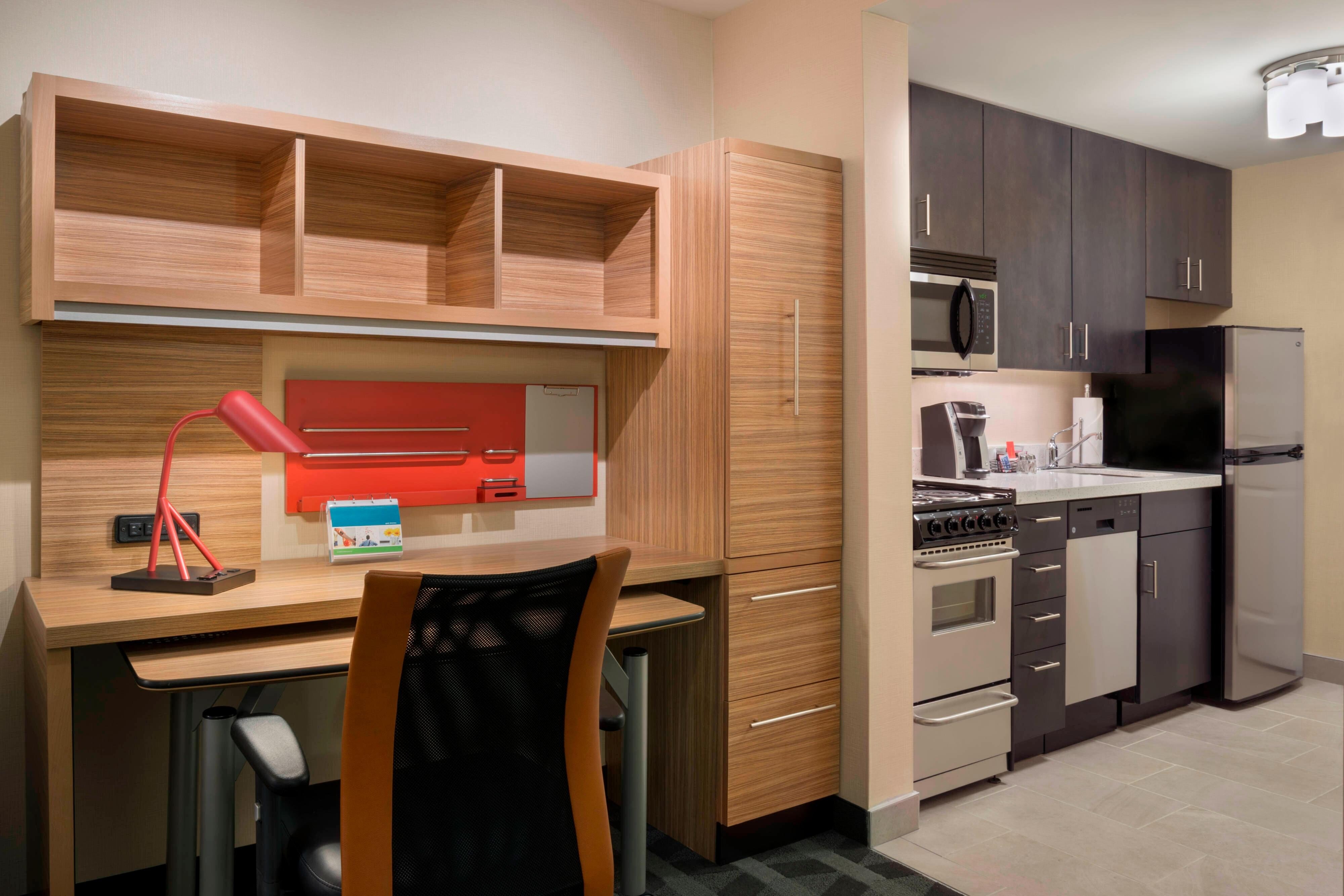 TownePlace Suites by Marriott Ottawa Kanata-guestroom-One-Bedroom Suite – Desk and Kitchen Area.jpg