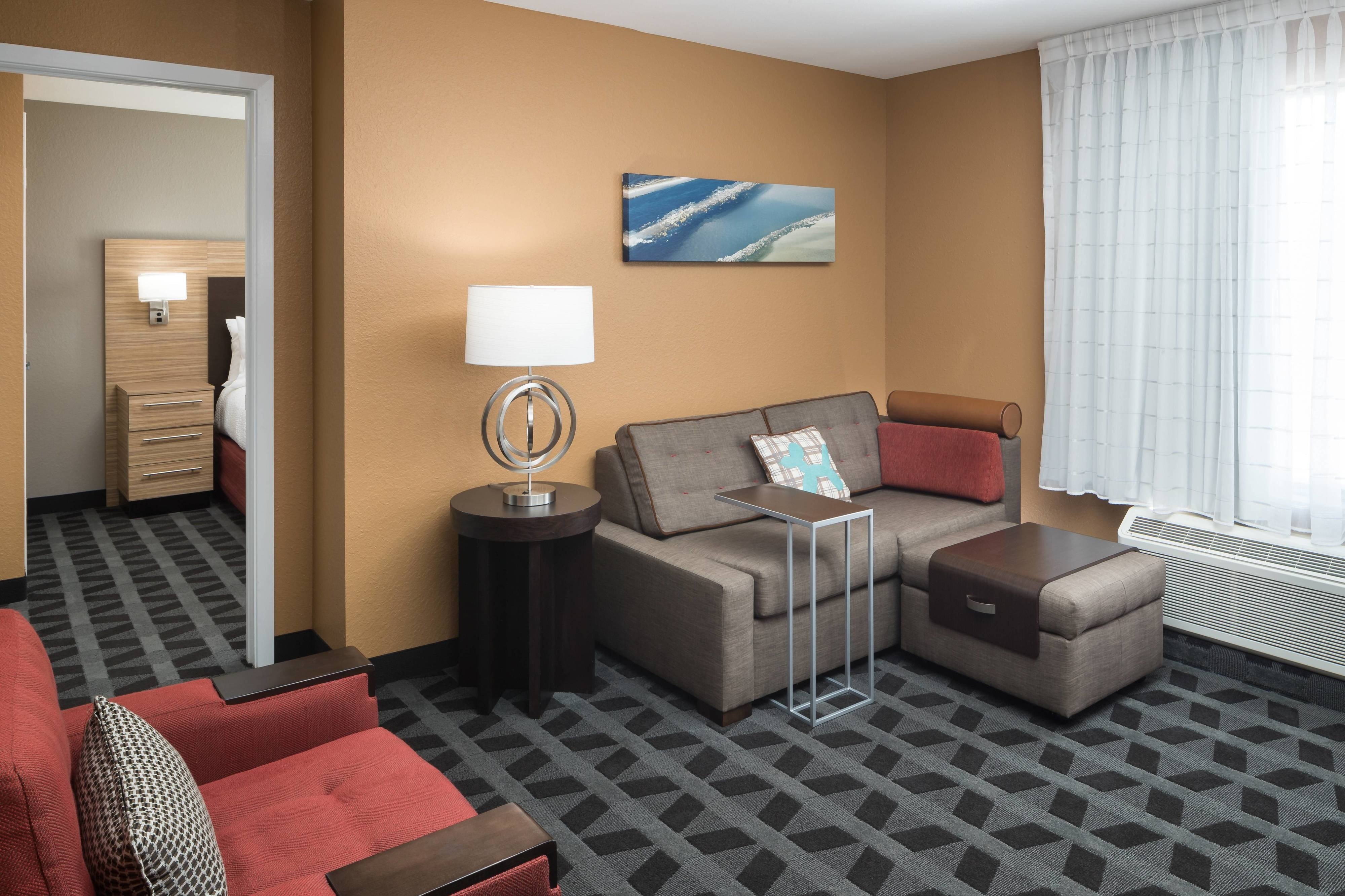 TownePlace Suites by Marriott Panama City-guestroom-One Bedroom Suite Living Area.jpg