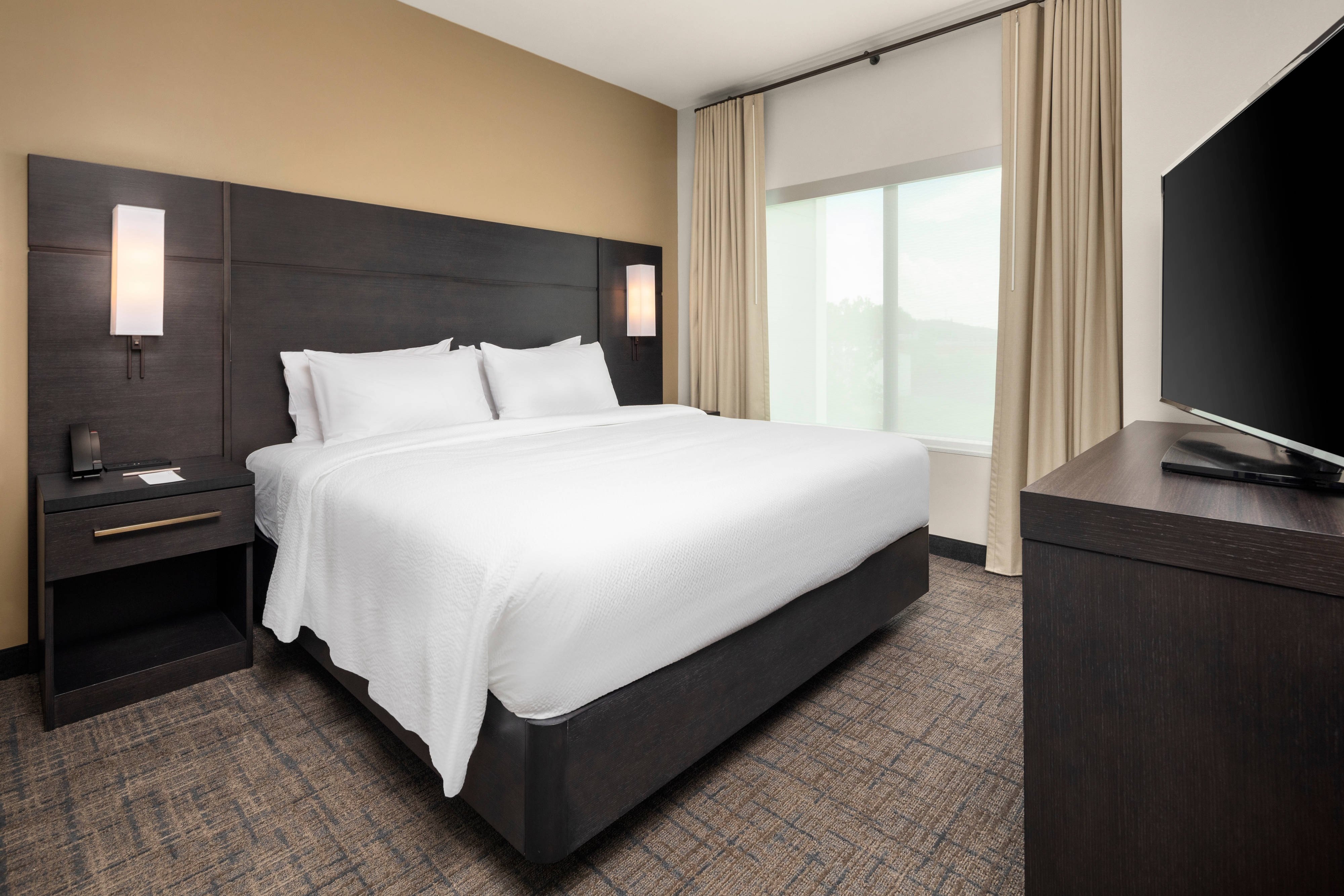 Residence Inn by Marriott Peoria East-guestroom-King Suite - Sleeping Area.jpg